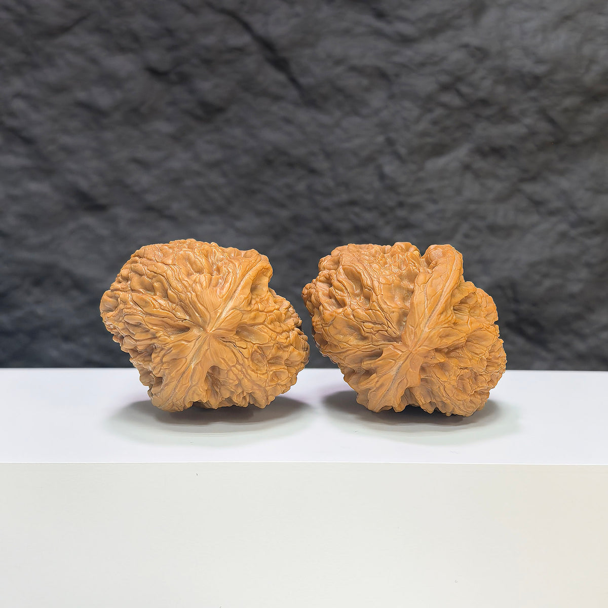 Pair of Wenwan Art Rolling Donkey Wenwan walnuts, 40mm, classic Chinese collectible walnuts with intricate carvings.