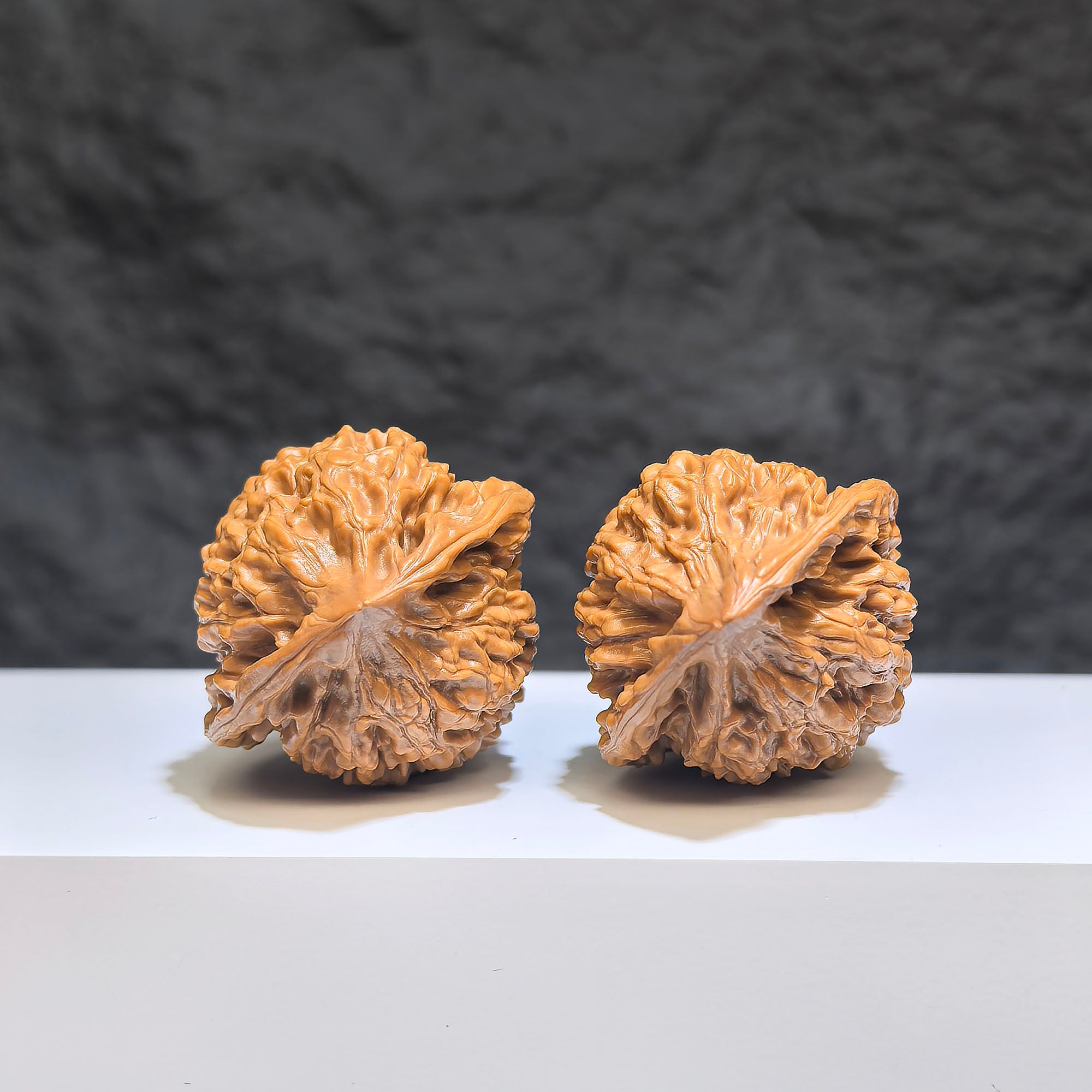Miniature Wenwan Walnuts pair from Wenwan Art, small official hat design, 34mm x 33mm, detailed carved walnut collectibles.