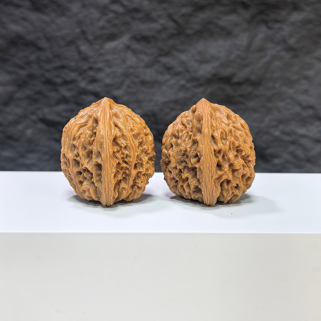 Pair of Nanjiangstone Wenwan walnuts from Wenwan Art, 36mm x 34mm, showcasing smooth, polished walnut-shaped carvings.