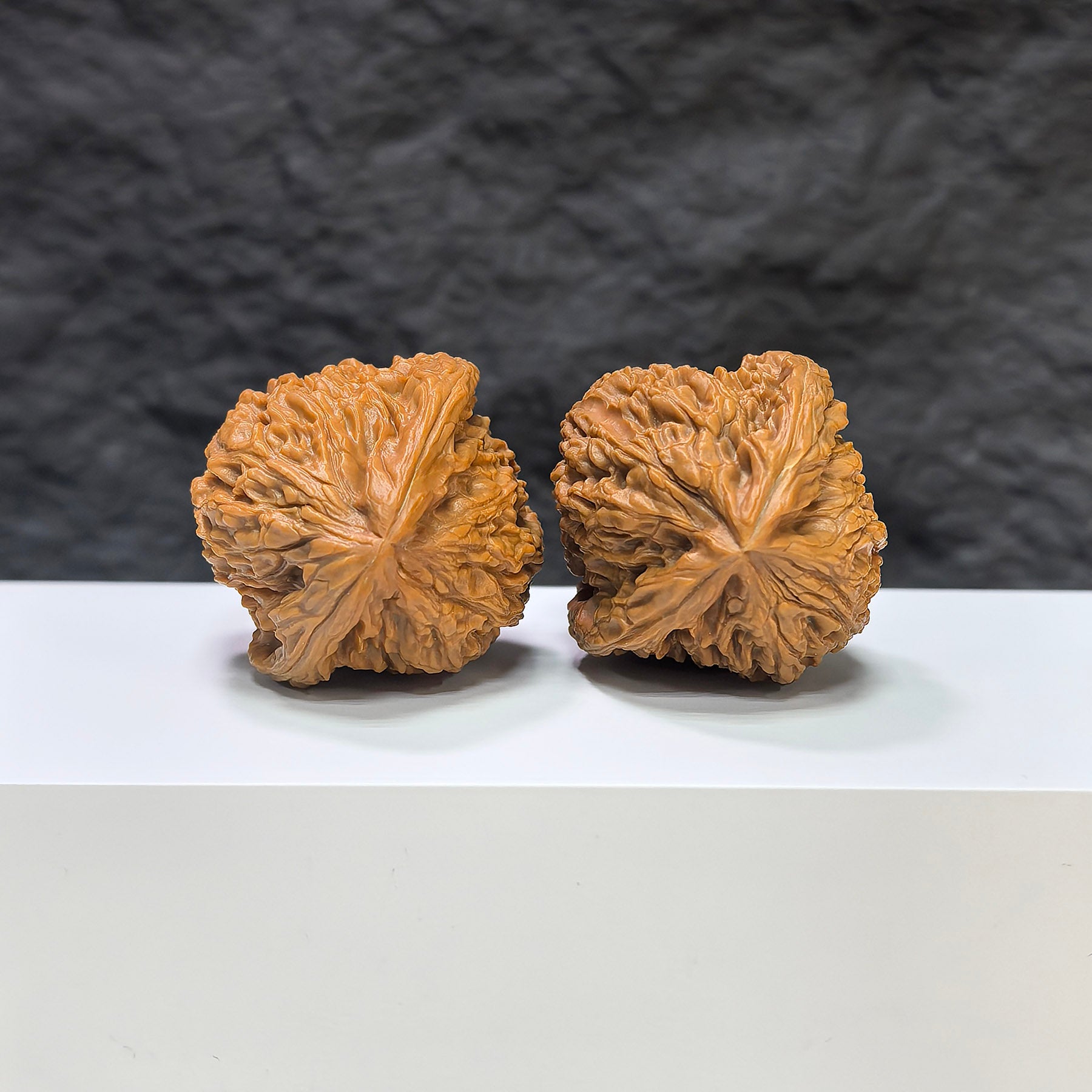 Selected grade Wenwan walnut stone with tri-angular shape, measuring 3.9×3.8cm, from Wenwan Art, showcasing polished surface and natural texture.