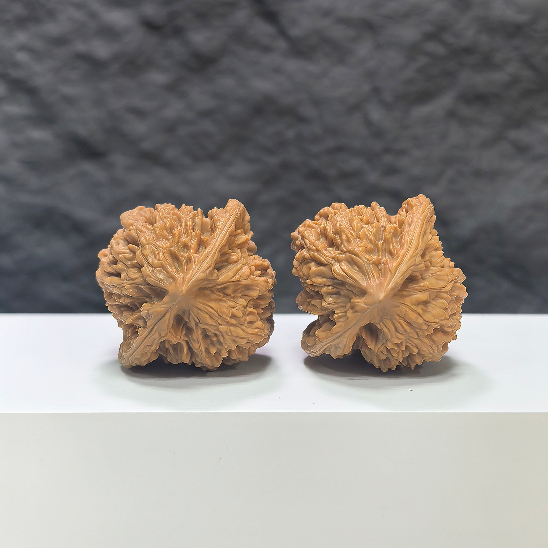 Pair of Peach Heart Xiayunling Wenwan walnuts from Wenwan Art, featuring smooth, polished surface and natural wood grain details.