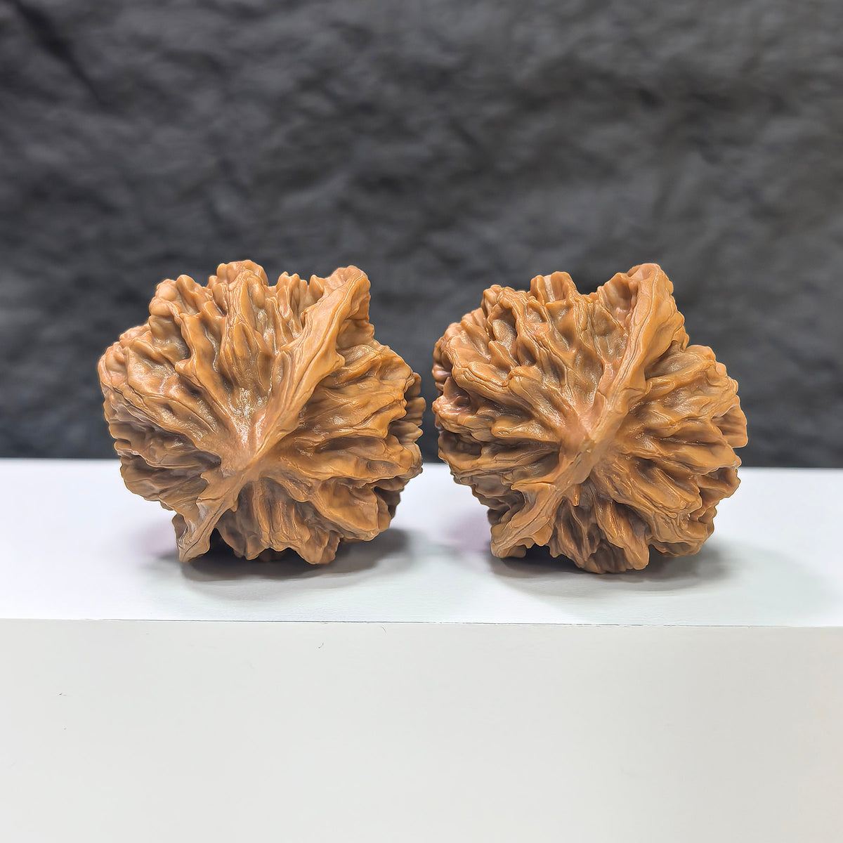 Pair of Emperor Wenwan Walnuts by Wenwan Art, 43mm x 42mm, showcasing intricate natural walnut carvings and rich brown tones.