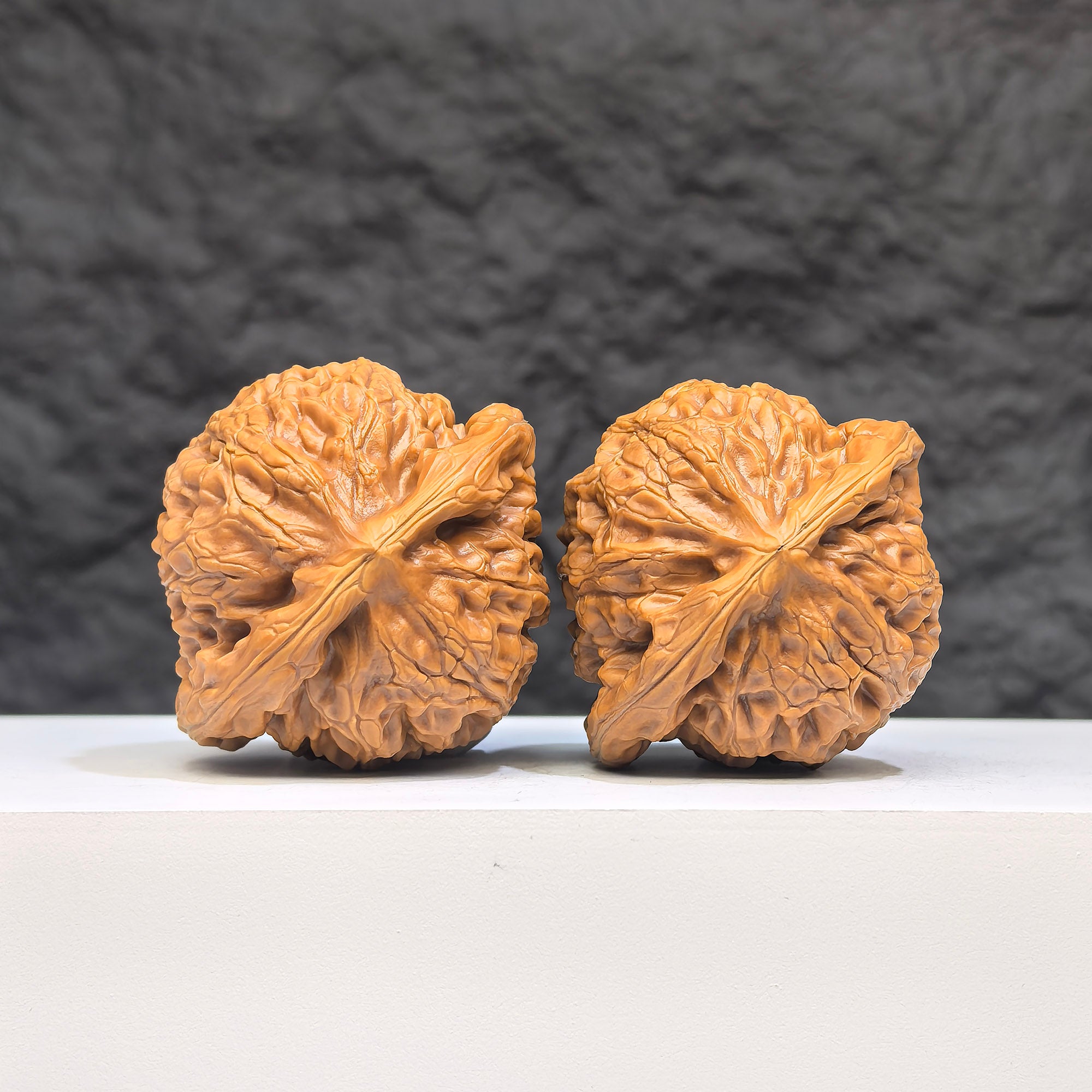 Pair of Palace Lantern Wenwan Walnuts from Wenwan Art, 41mm x 37mm, showcasing intricate carved designs and natural walnut texture.