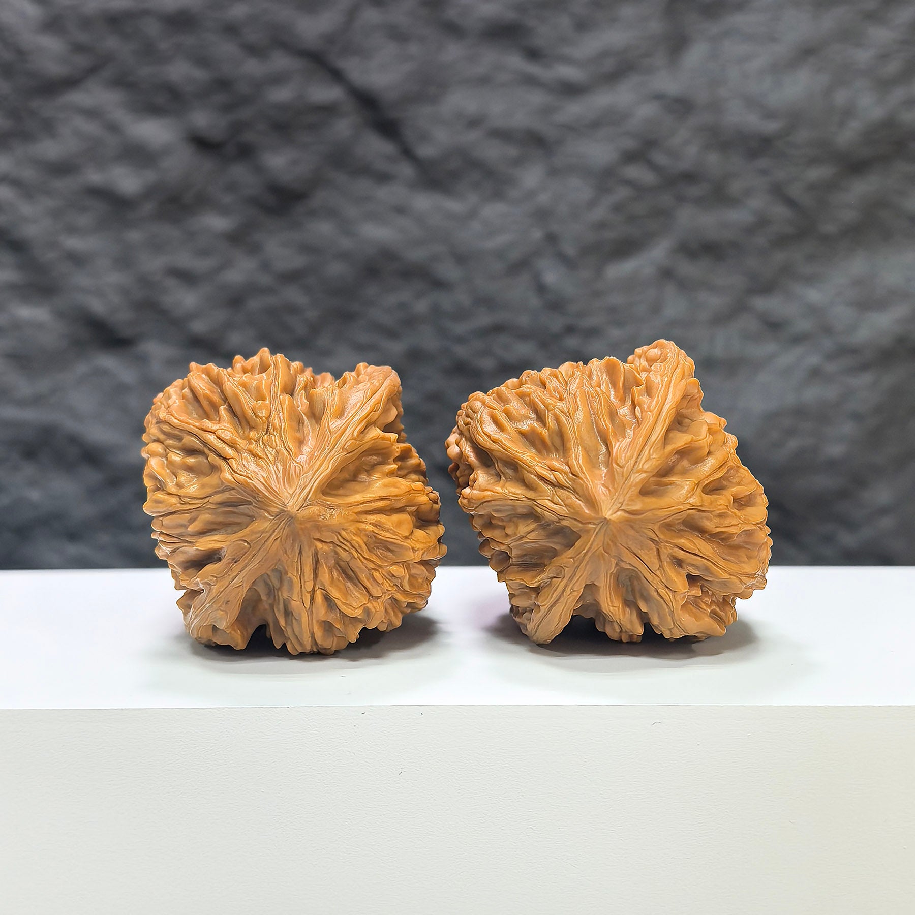 Pair of Beijing Chicken Heart Wenwan Walnuts from Wenwan Art, featuring 43mm x 45mm smooth, polished walnut carvings.