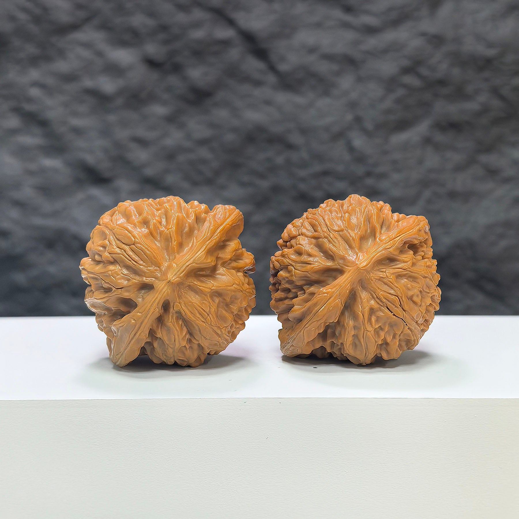 Pair of Classic Scholar Wenwan Walnuts by Wenwan Art, hand-matched, 43mm x 38mm, showcasing detailed natural wood grain.