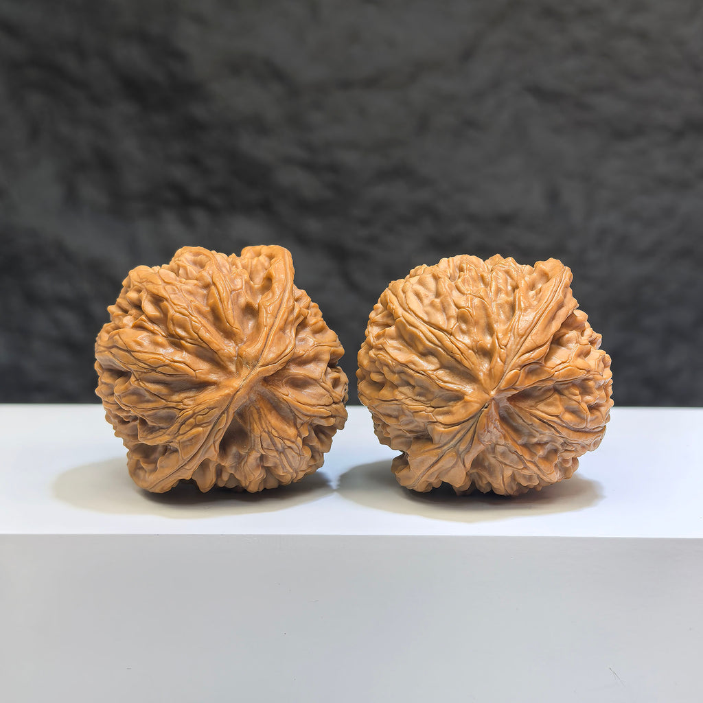 Pair of Classic Scholar Wenwan Walnuts by Wenwan Art, hand-matched spherical walnuts, 41mm and 38mm in size, featuring 球形宮燈 design.