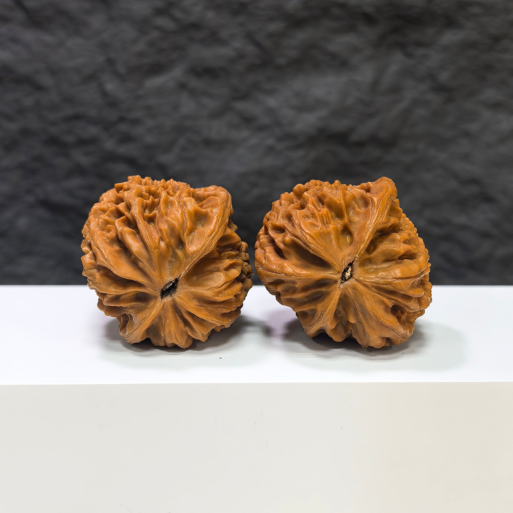 Pair of Pinggu Golden Hammer Wenwan walnuts from Wenwan Art, 39mm x 41mm, featuring smooth, polished walnut shells with golden hues.
