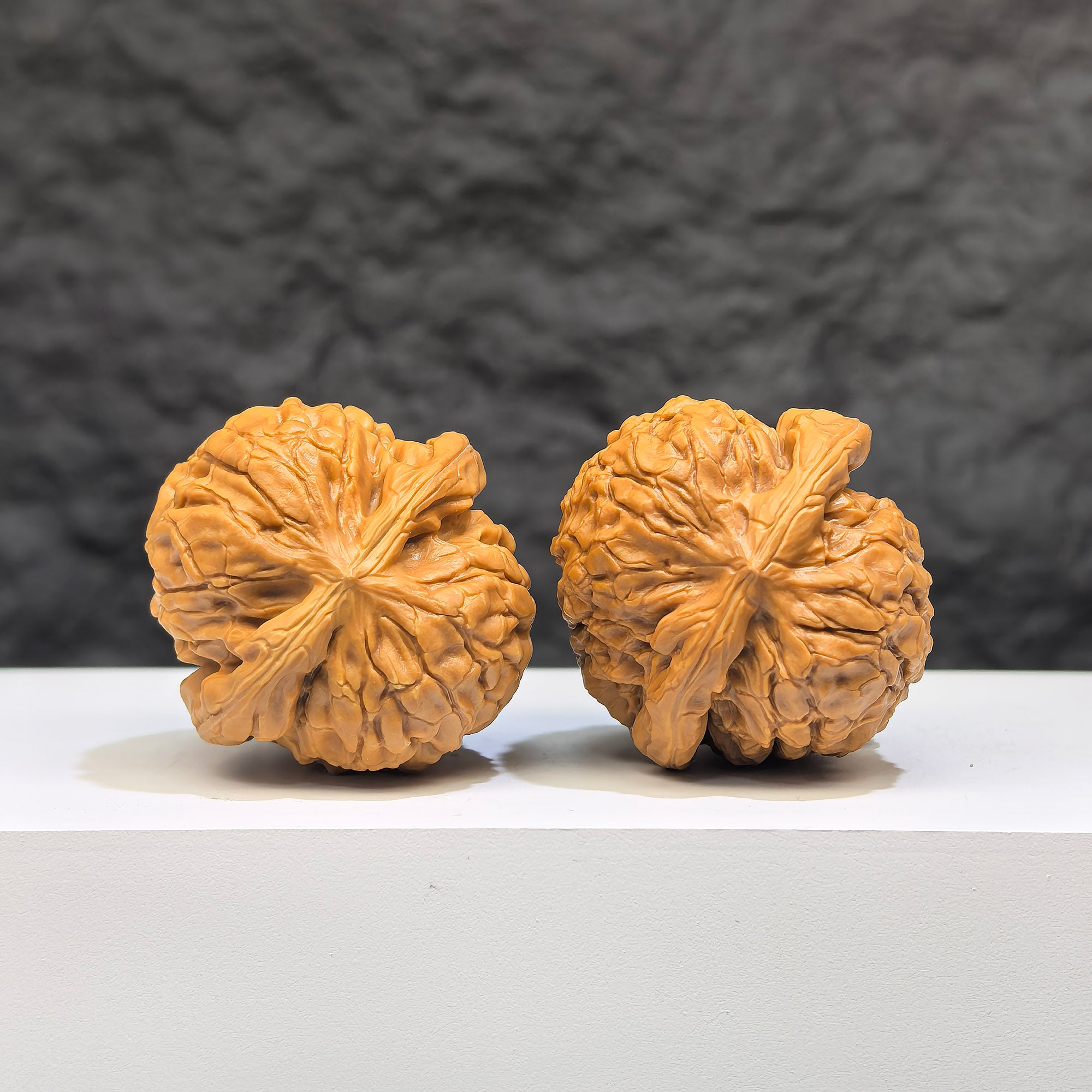 Miniature Wenwan Walnut featuring Oracle Bone Script carvings from Wenwan Art, measuring 33mm x 31mm, pair of pocket-sized walnuts.