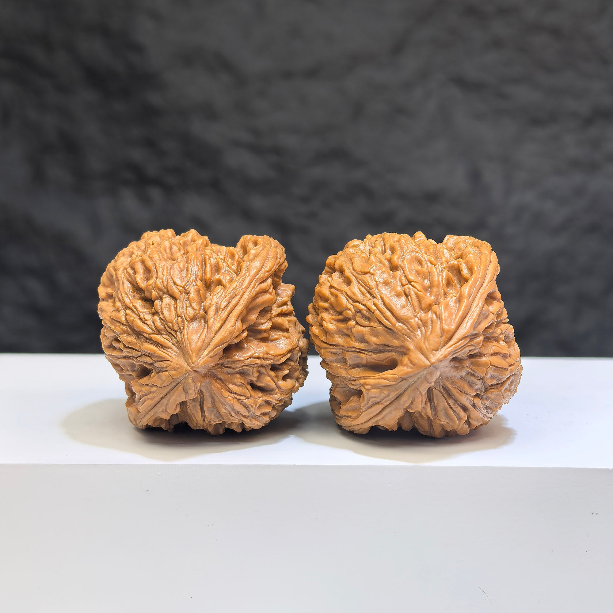 Pair of Nanjiangstone Wenwan walnuts by Wenwan Art, 38mm size, showing detailed natural stone patterns and smooth polished surface.
