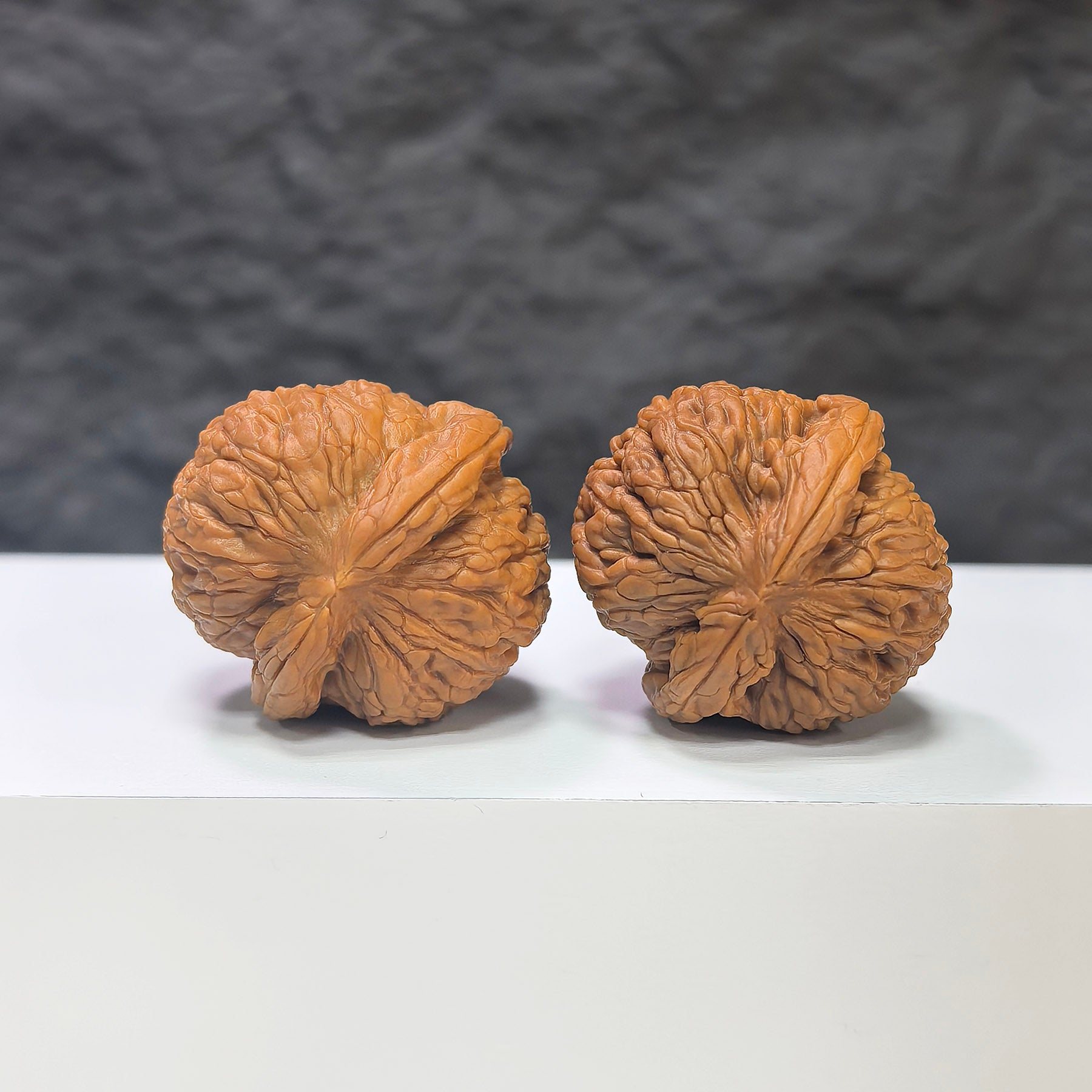 Miniature Wenwan Walnut pair with pocket meteorite sycee carvings, 30mm x 31mm, from Wenwan Art, showcasing detailed craftsmanship.