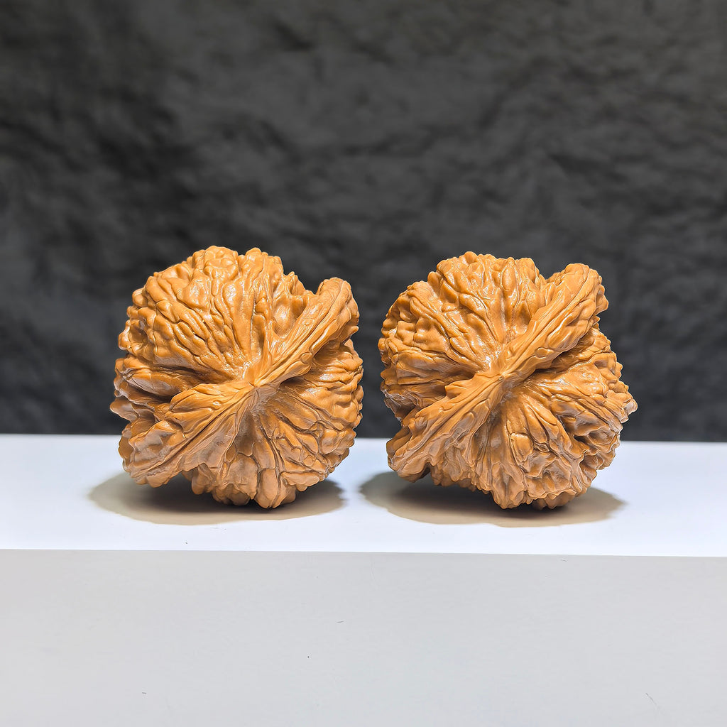 Pair of spherical white lion Wenwan walnuts from Wenwan Art, round-profile, 43mm x 40mm, featuring detailed lion carvings.