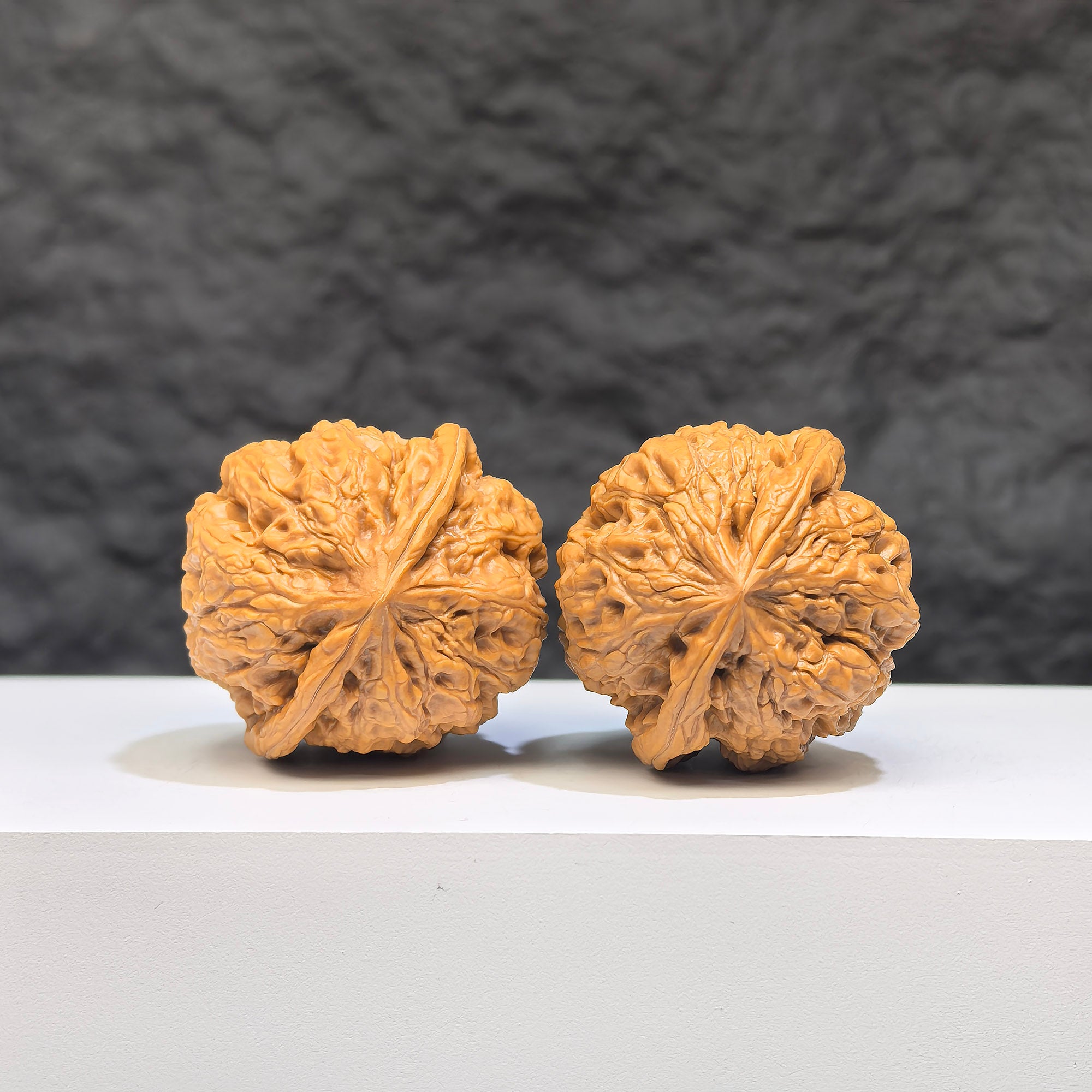 Miniature Wenwan Walnut pair with Yuhua stone, 34mm x 33mm, from Wenwan Art, showcasing detailed natural stone textures.