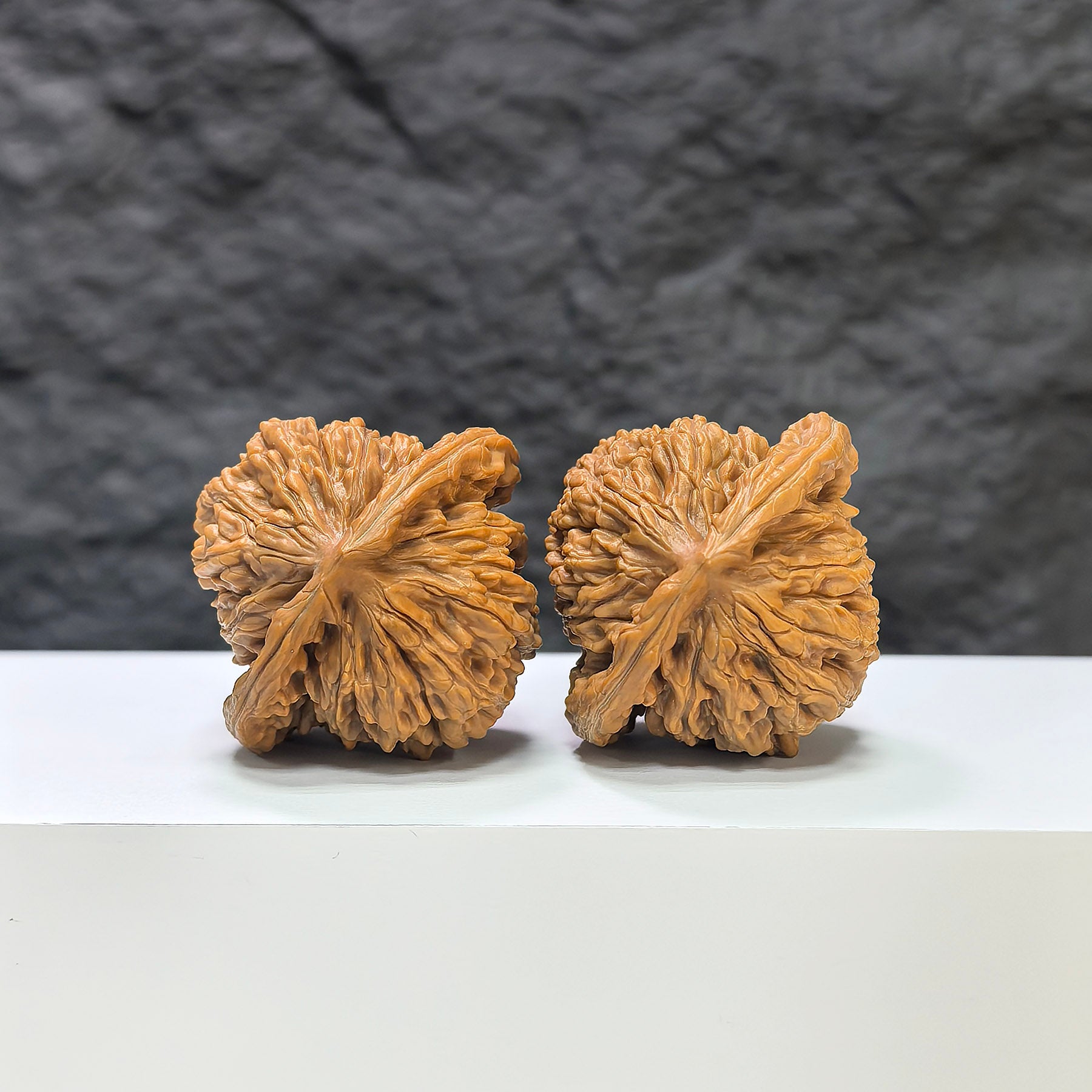 Pair of Sizuolou Classic Wenwan Walnuts by Wenwan Art, 41mm x 38mm, showing detailed carved walnut art and natural wood texture.