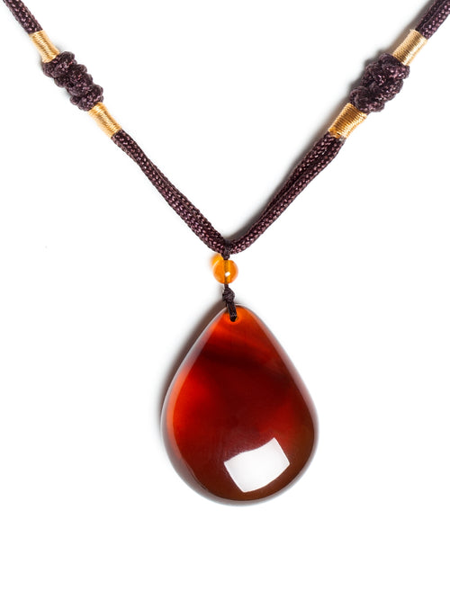 Authentic brownish-red freeform amber pendant with natural Myanmar amber, weighing 11g, showcasing unique shape and warm tones.