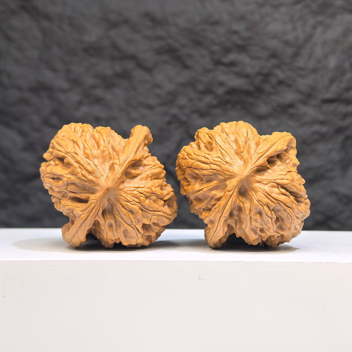 Pair of authentic Wild Wolf Wenwan walnuts from Wenwan Art, featuring natural wood grain and 38mm x 40mm size.