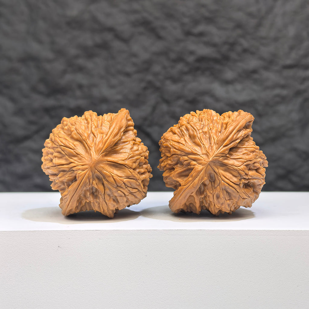 Wenwan Art Millstone Classic Wenwan Walnut pair, 37mm x 34mm, showcasing detailed carved designs and natural walnut texture.