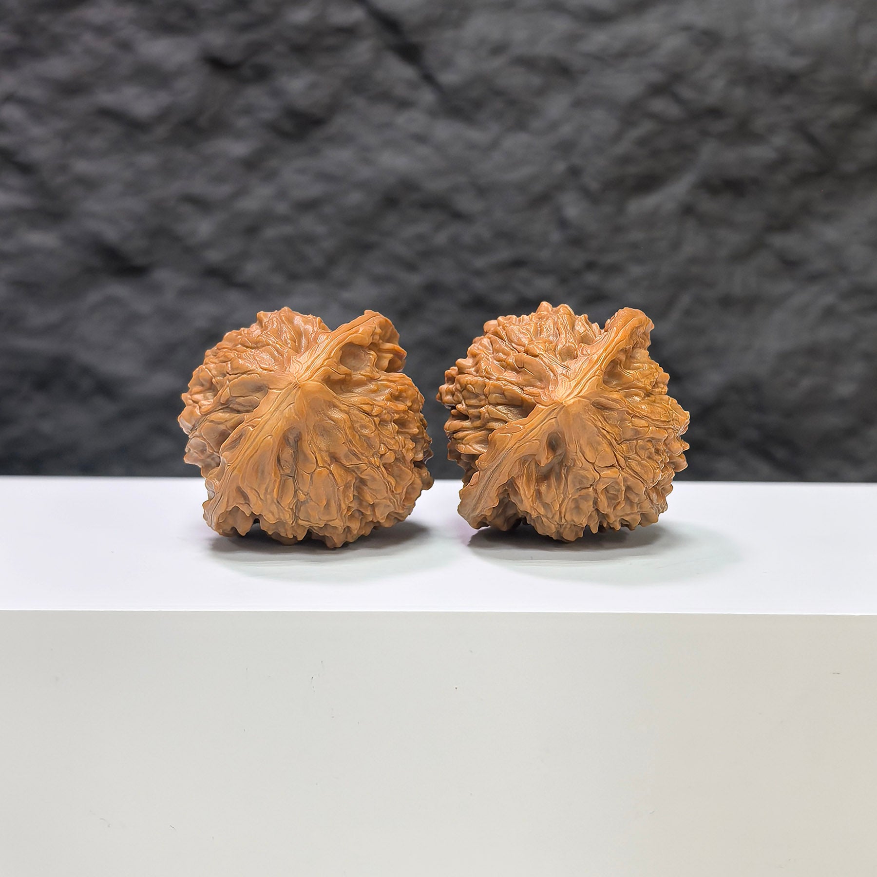 Golden Kylin Wenwan Walnut pair by Wenwan Art, featuring intricate carvings, measuring 37mm x 36mm, showcasing detailed craftsmanship.