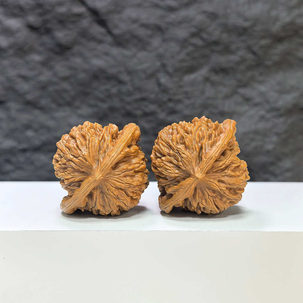 Pair of Sizuolou Classic Wenwan Walnuts by Wenwan Art, 41mm x 37mm, showing detailed textures and natural wood grain.
