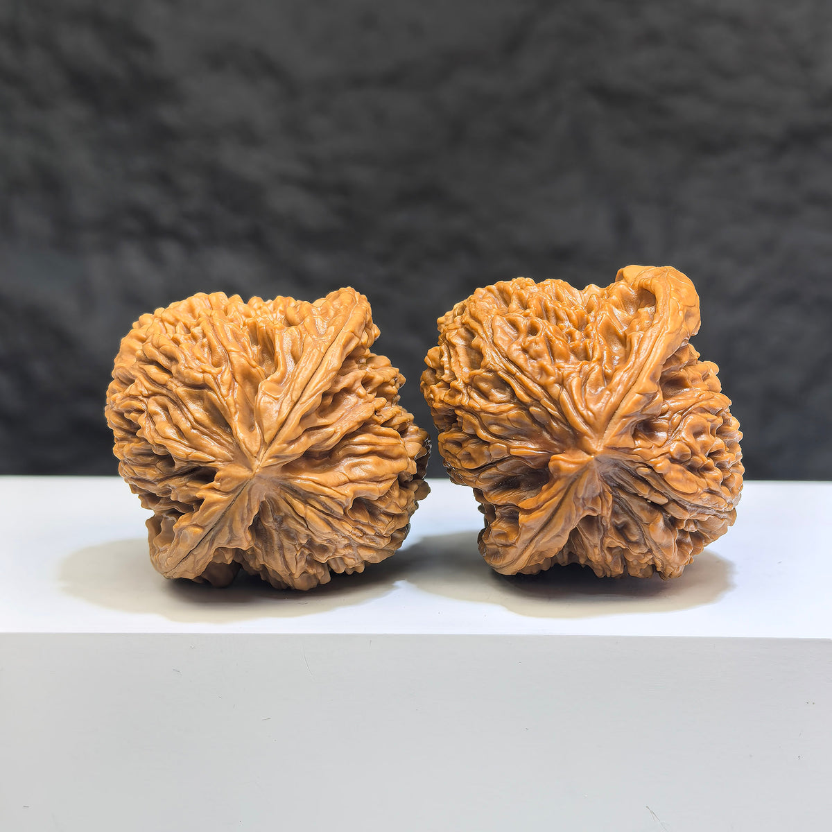 Pair of Wenwan Walnut with triangular concave base, made of Nanjiangstone, deep-base design, 40mm size, by Wenwan Art.