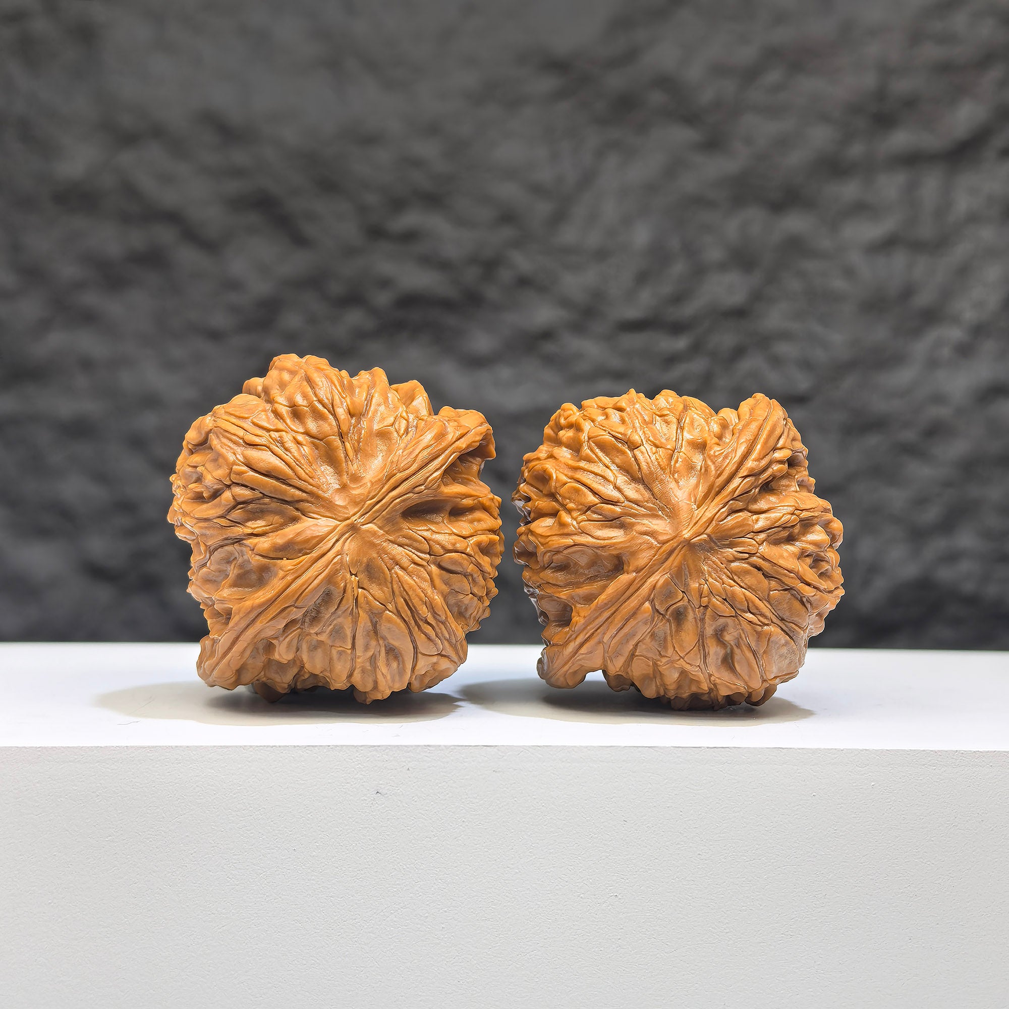 Red Shell Millstone Wenwan Walnut pair by Wenwan Art, 39mm x 38mm, showcasing smooth, polished reddish shells and intricate patterns.