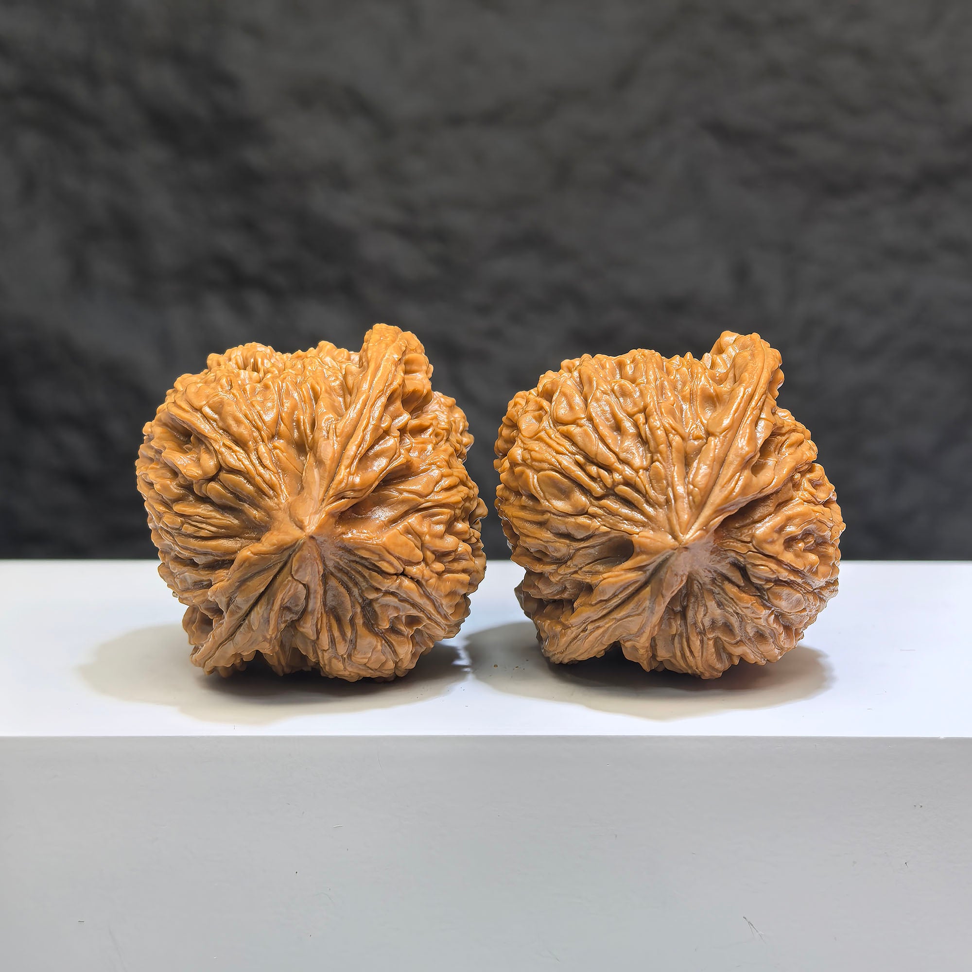 Pair of Classic Scholar Wenwan Walnuts from Wenwan Art, hand-matched with triangular recessed South Xinjiang stone, 42mm size.