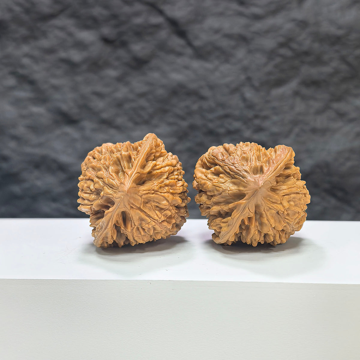 Pair of Wild Wenwan Walnuts from Wenwan Art, authentic Wild Official Hat design, 39mm x 38mm, natural walnut finish.