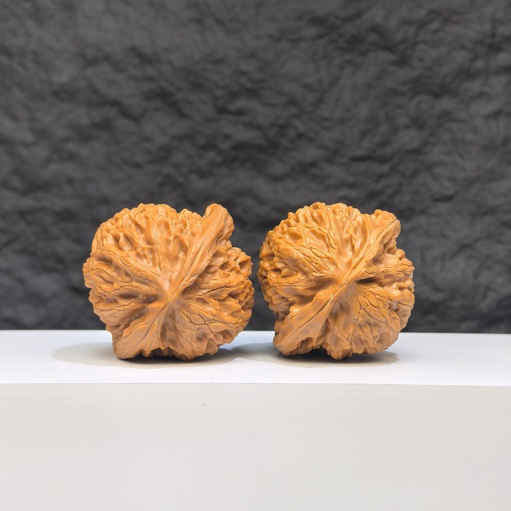 Pair of Palace Lantern Wenwan walnuts by Wenwan Art, 42mm x 40mm, showcasing detailed carved designs on smooth walnut surfaces.