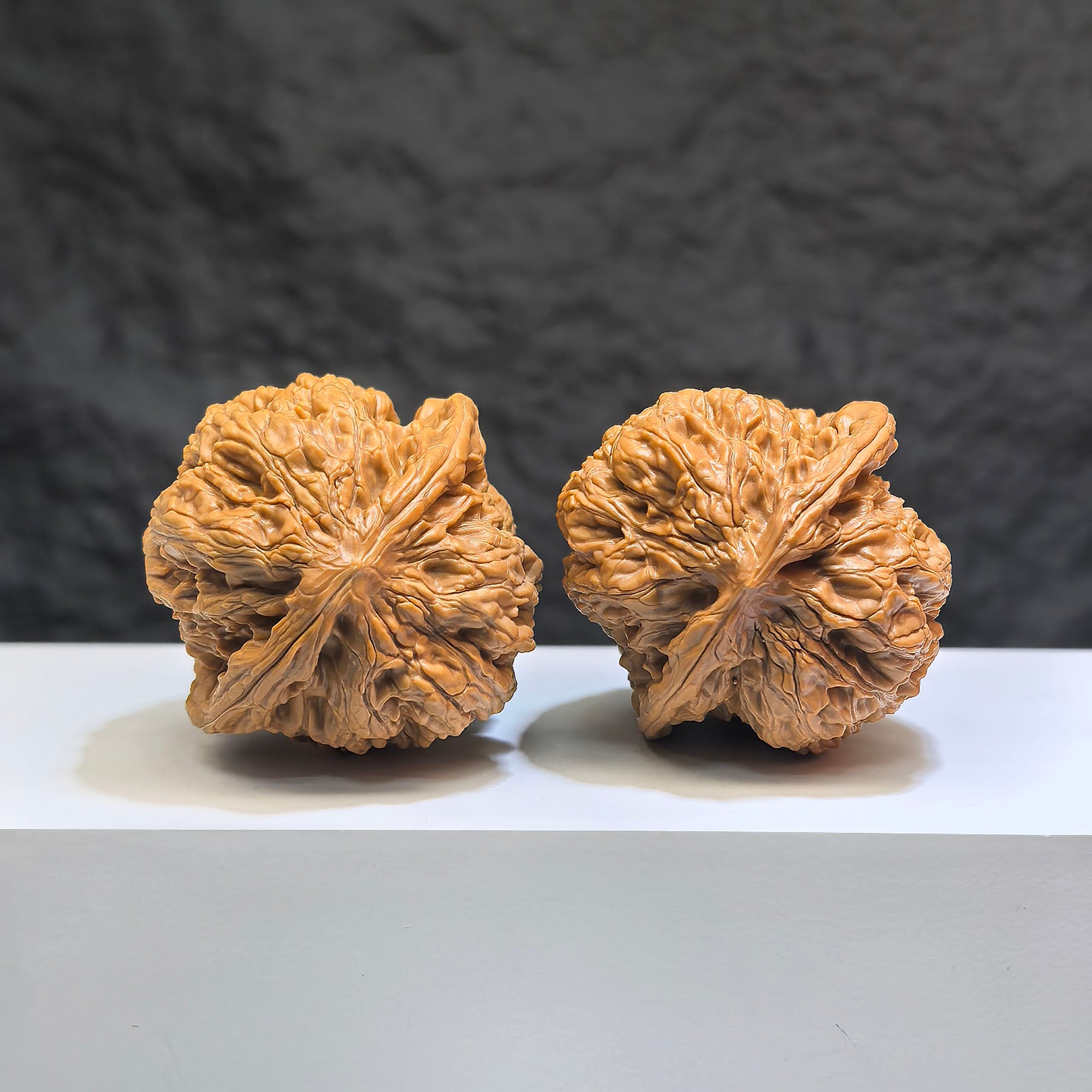 Pair of Classic Scholar Wenwan Walnuts by Wenwan Art, hand-matched with detailed natural wood grains, size 44mm x 42mm.