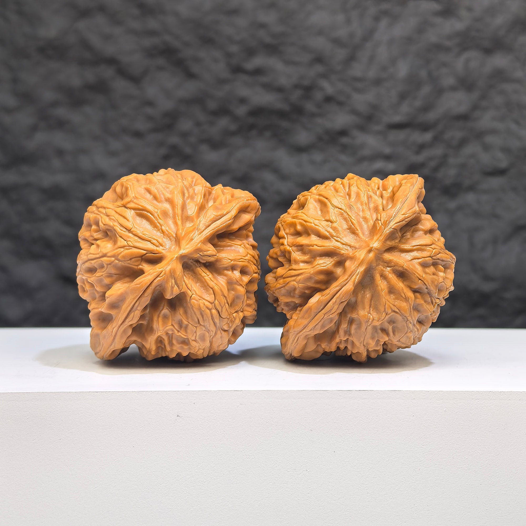 Pair of Palace Lantern Wenwan walnuts from Wenwan Art, 44mm x 38mm, featuring intricate carvings and traditional designs.