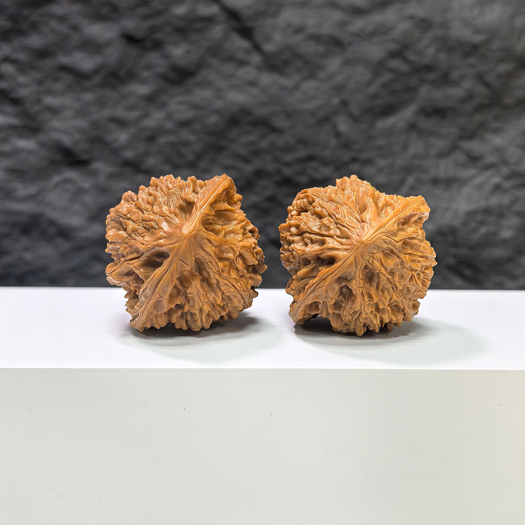 Golden Kylin Wenwan walnut pair by Wenwan Art, 40mm x 38mm, featuring detailed carvings and rich golden color.
