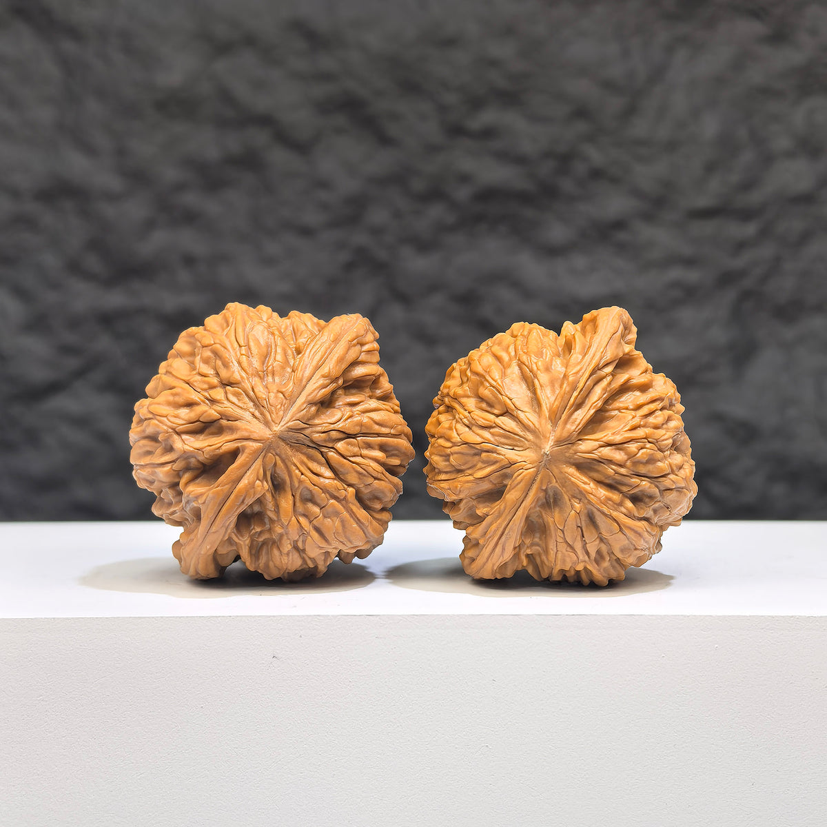 Miniature Wenwan Walnut pair, Pocket Symmetrical Millstone style, crafted by Wenwan Art, measuring 36mm by 33mm.