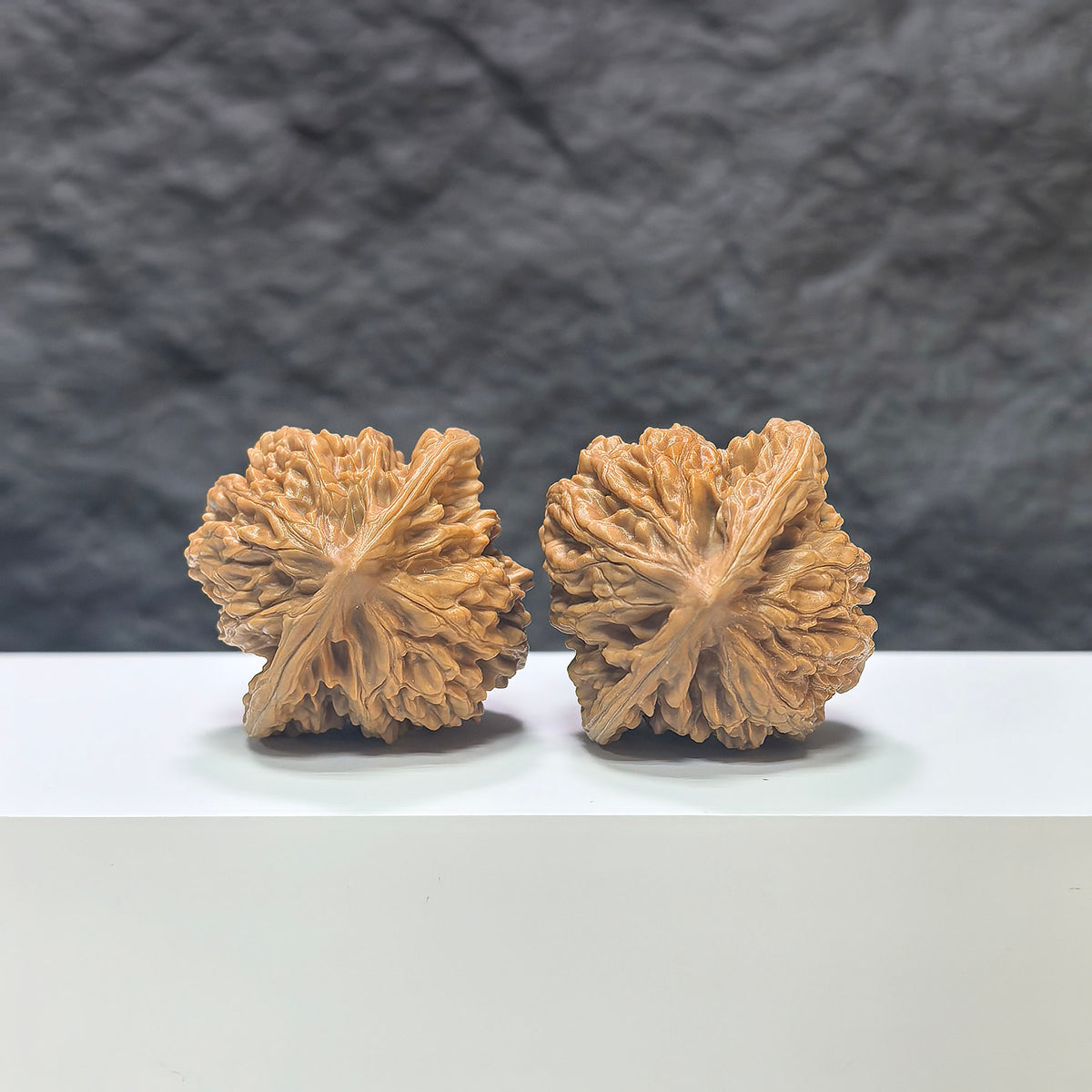 Pair of Peach Heart Xiayunling Wenwan walnuts from Wenwan Art, featuring 41mm x 39mm natural carved walnuts with intricate details.