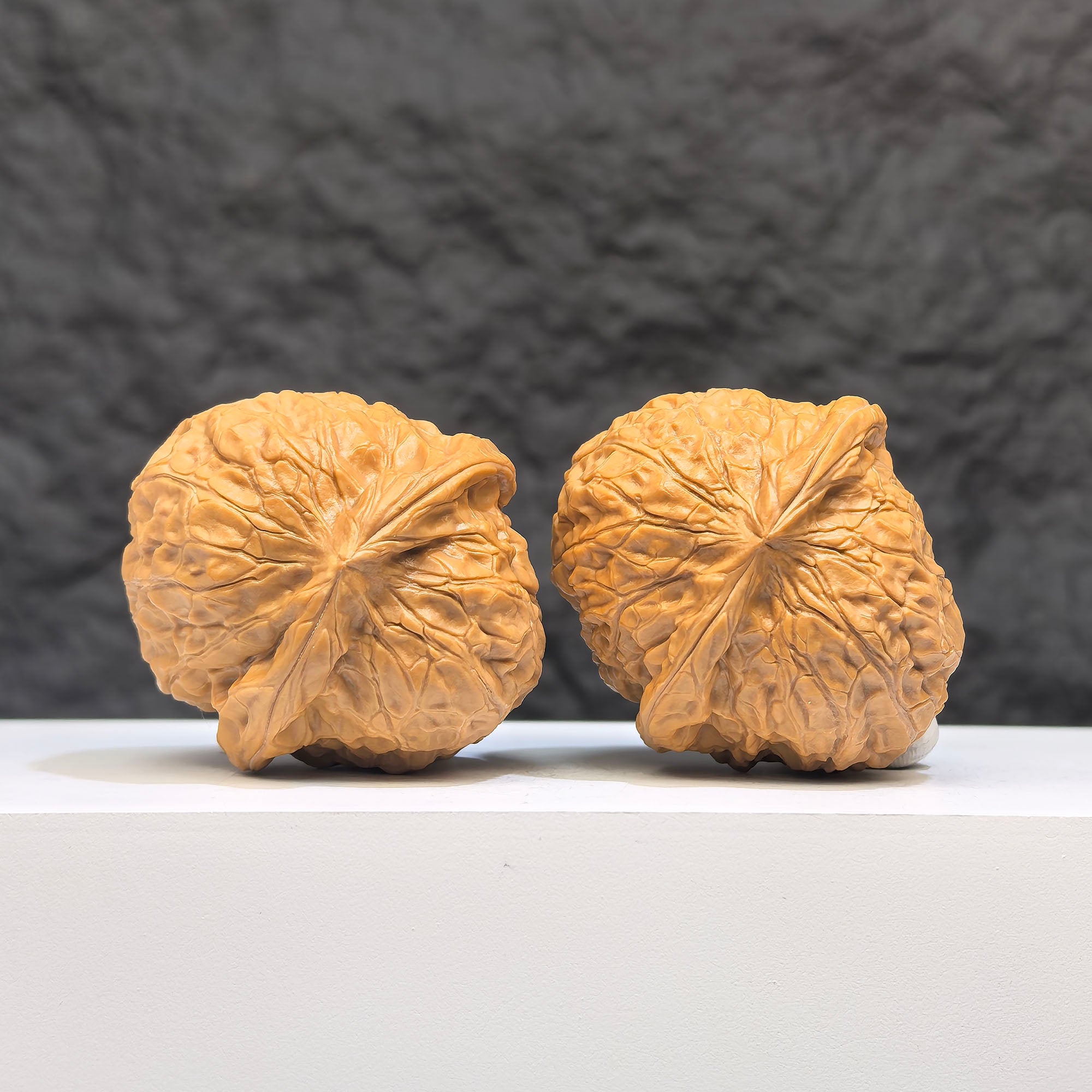 Miniature Wenwan Walnuts pair by Wenwan Art, small pumpkin-shaped Wenwan walnuts measuring 39x42mm, natural wood finish.