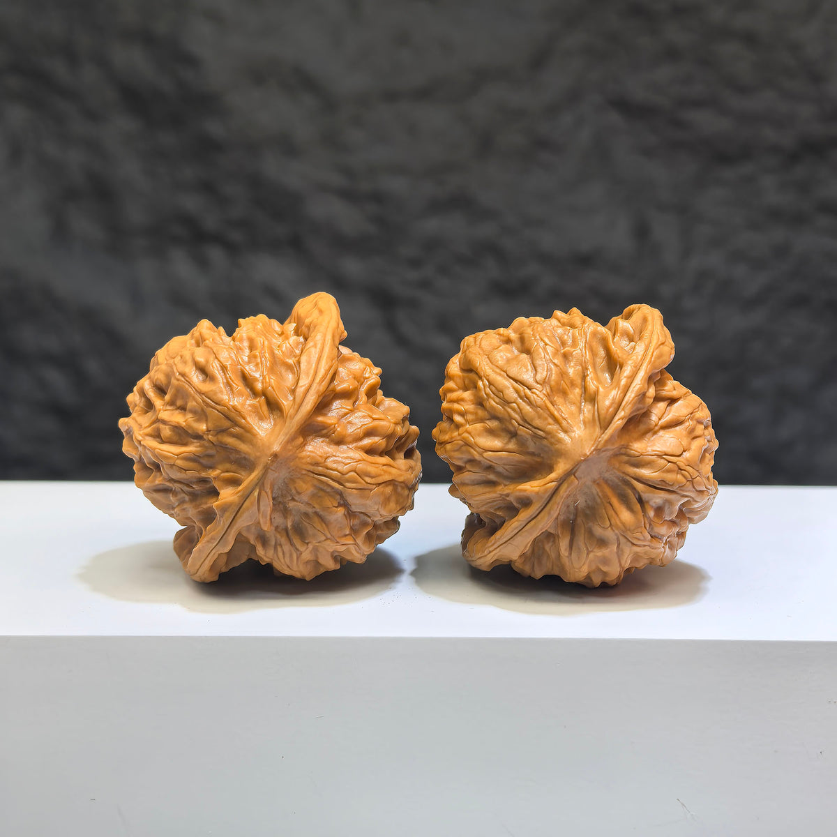 Pair of Wild Wolf Yelang Deep-Carved Wenwan Walnuts by Wenwan Art, 39mm x 37mm, showcasing detailed natural walnut carvings.