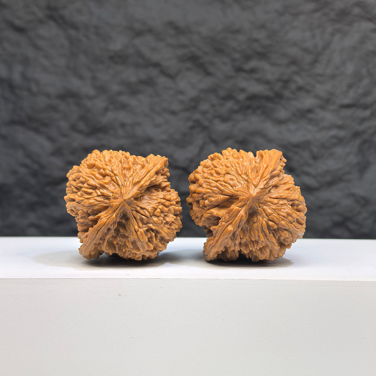 Pair of Babys Breath Wenwan Walnuts by Wenwan Art, featuring full star carvings, 38mm size, showcasing intricate craftsmanship.