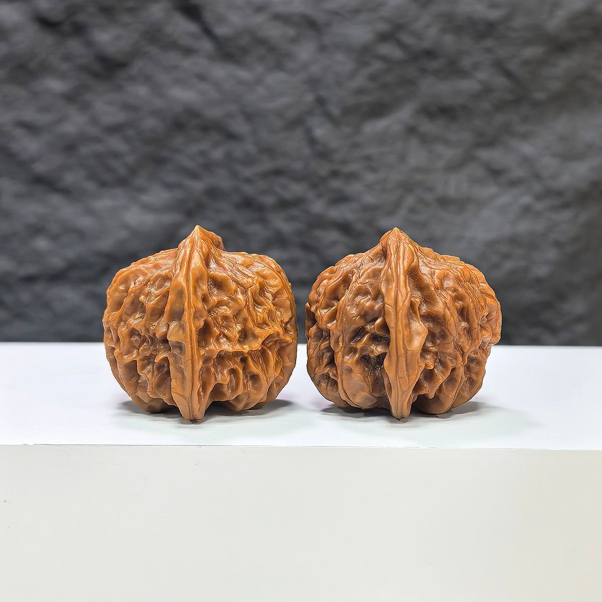 Pair of Wenwan Art Pocket Sizuolou miniature Wenwan walnuts, 33mm size, featuring detailed craftsmanship and natural wood grain.