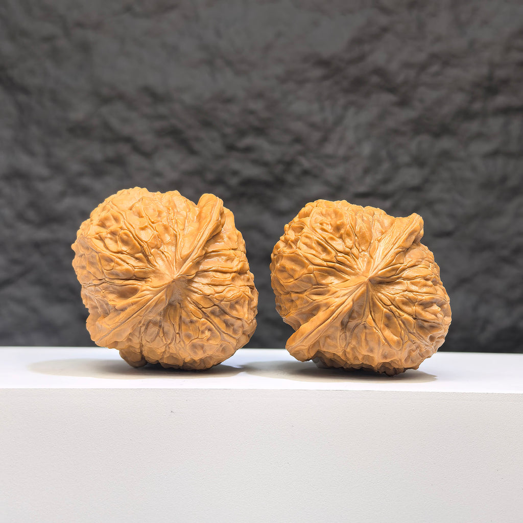 Pair of Pumpkin Pier Wenwan Walnuts by Wenwan Art, 41mm x 44mm, showcasing detailed carved pumpkin design.