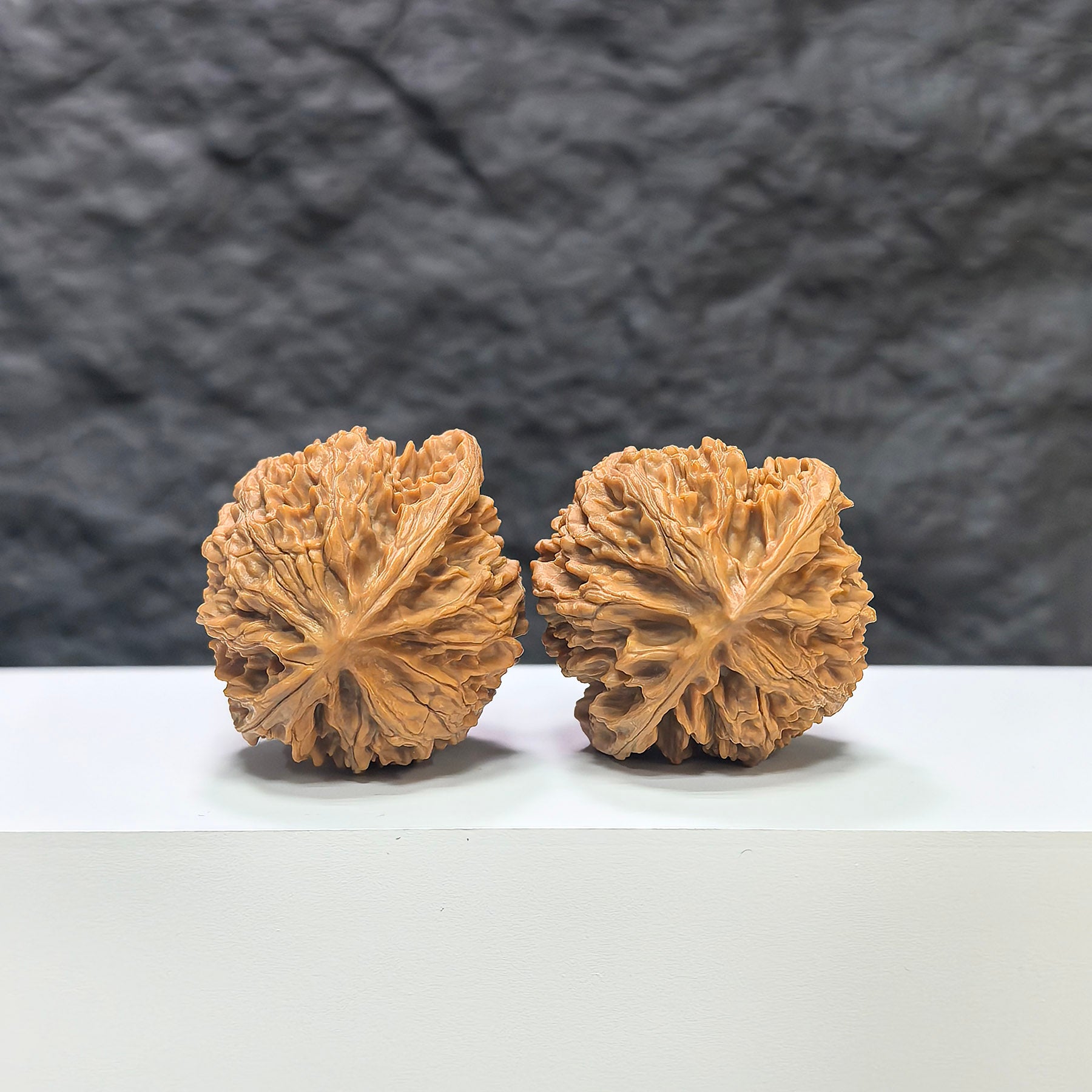 Pair of Wenwan Art Apple Garden Peach Heart Concave Base Wenwan walnuts, 40mm x 37mm, showing detailed surface textures.