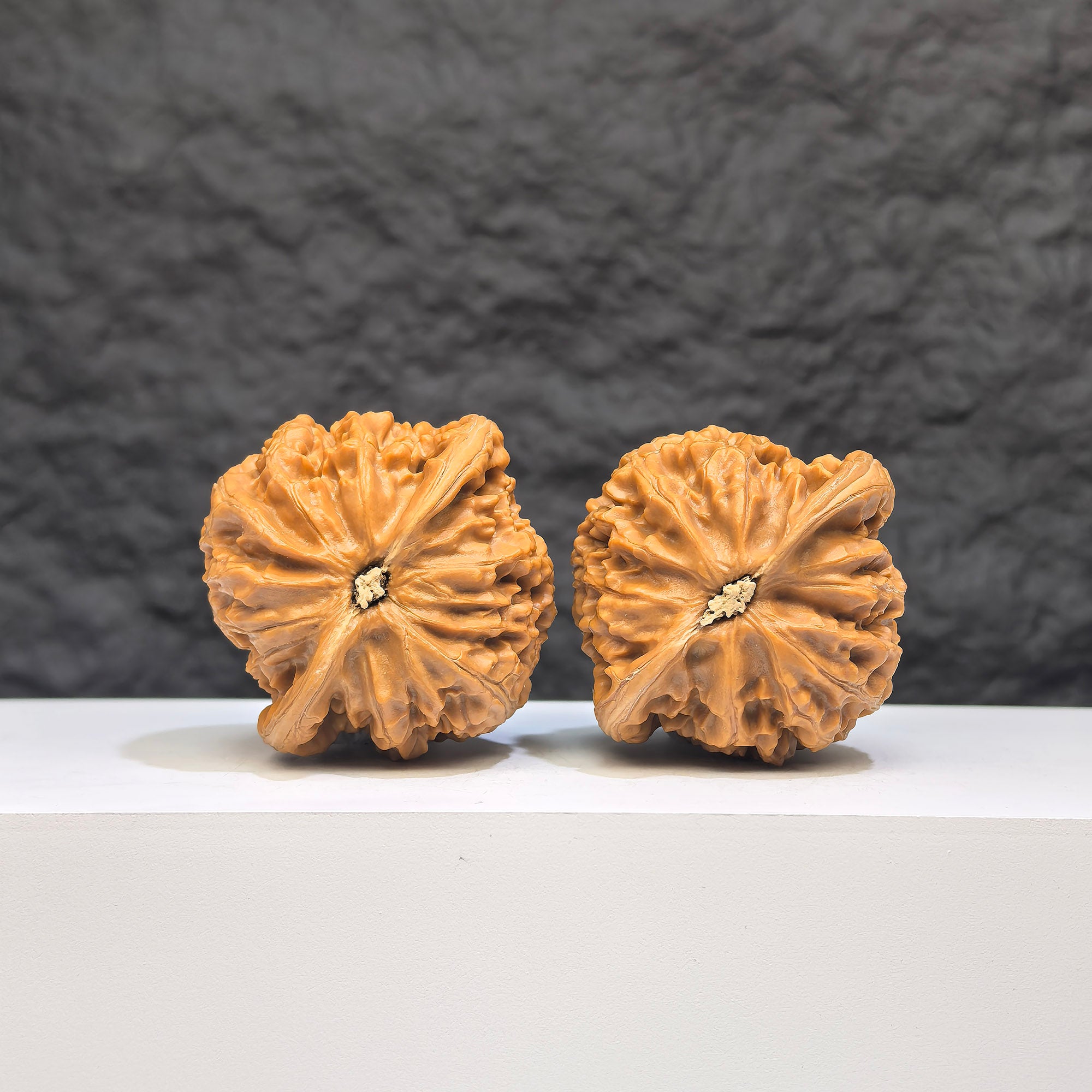Pair of Palace Lantern Wenwan walnuts from Wenwan Art, 42mm x 40mm, showcasing detailed carved designs on smooth walnut surfaces.