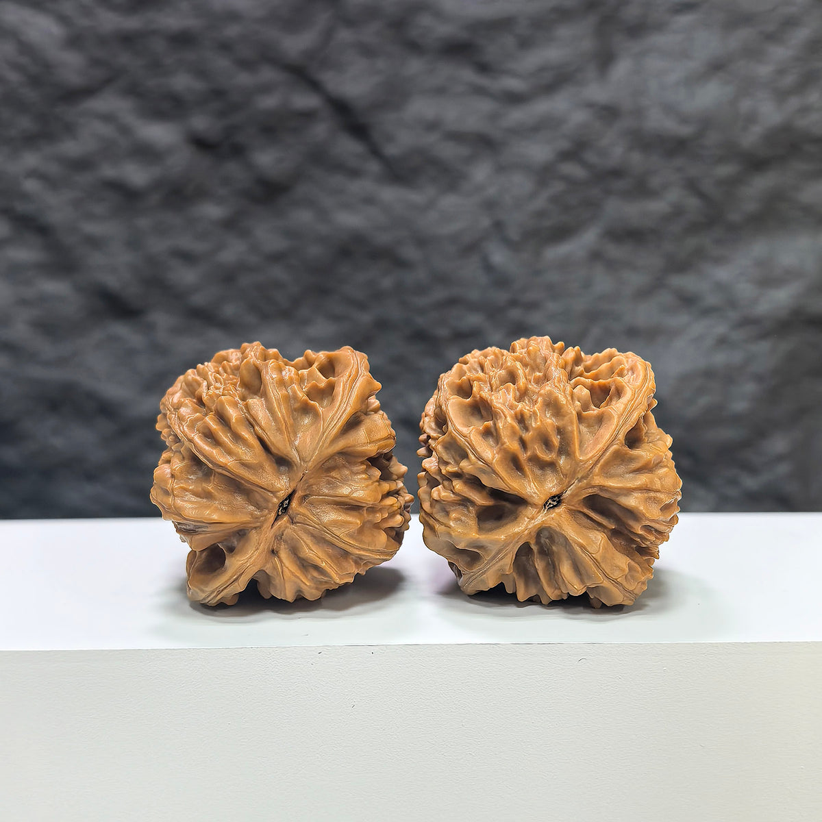 Pair of Beijing Chicken Heart Wenwan walnuts by Wenwan Art, 41mm x 40mm, showcasing unique natural patterns and smooth surface.