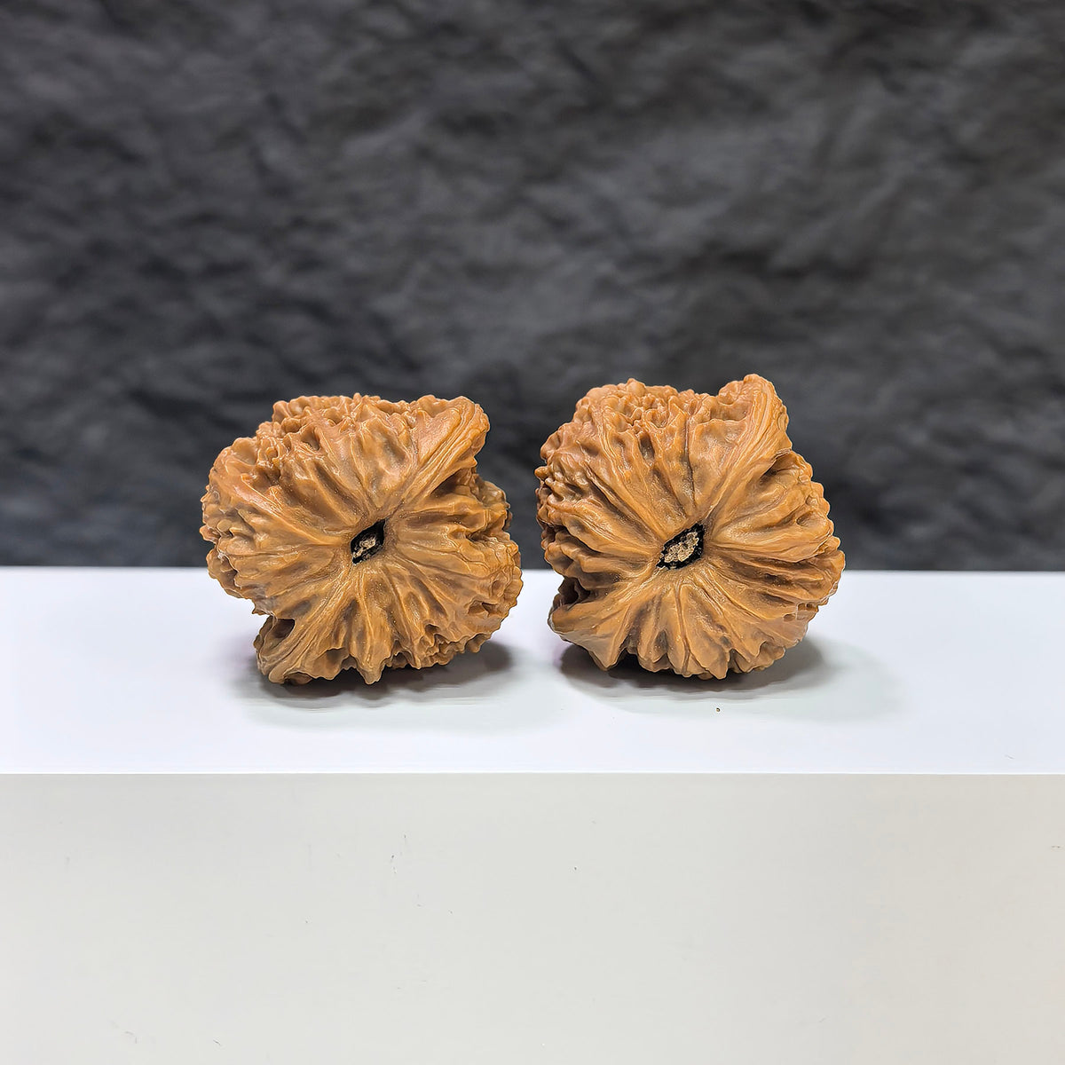 Pair of Nanjiangstone Wenwan walnuts by Wenwan Art, featuring 36mm and 34mm carved classic walnut sculptures with intricate details.