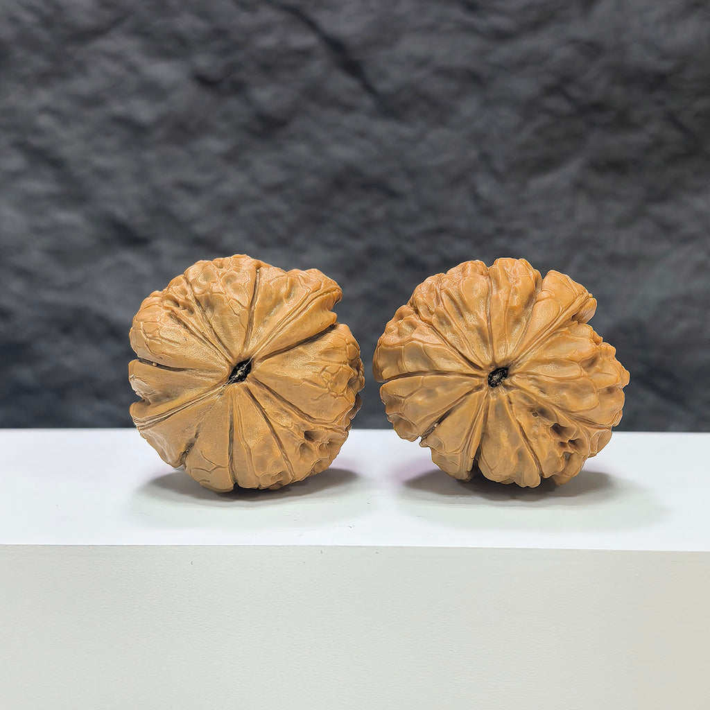 Pair of Classic Scholar Wenwan Walnuts by Wenwan Art, hand-matched 39mm size with intricate carvings and natural wood grain.