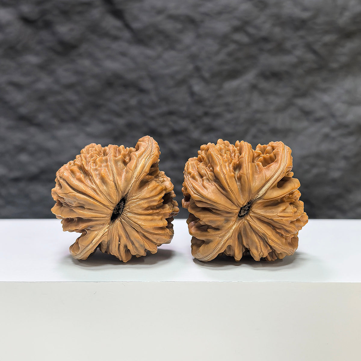 Pair of Sizuolou Wenwan Walnuts from Wenwan Art, 39mm x 37mm, showcasing detailed carved walnut art.