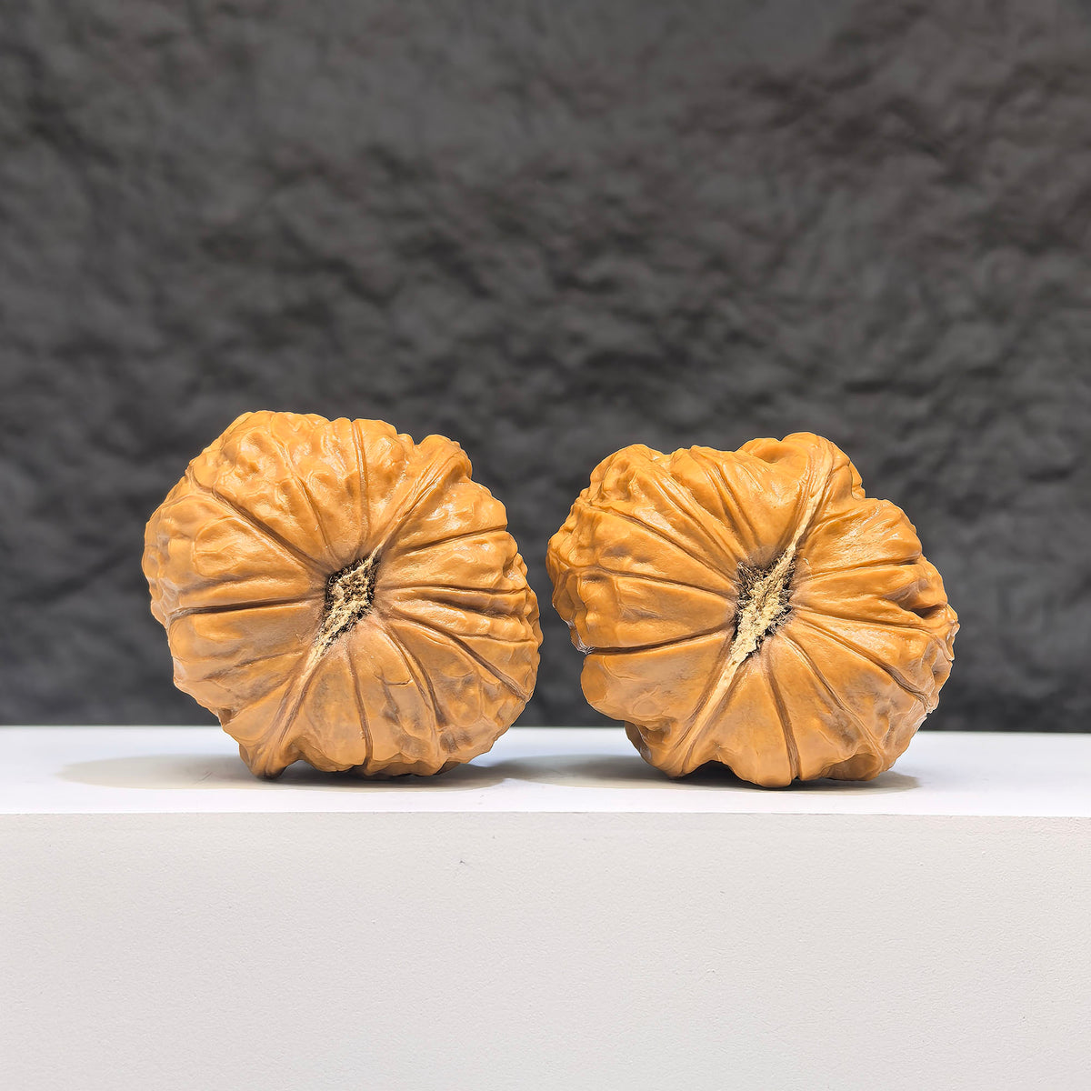 Pair of small Wenwan Walnuts from Wenwan Art, miniature pumpkin-shaped Wenwan walnuts, 38mm x 40mm, detailed wood carvings.