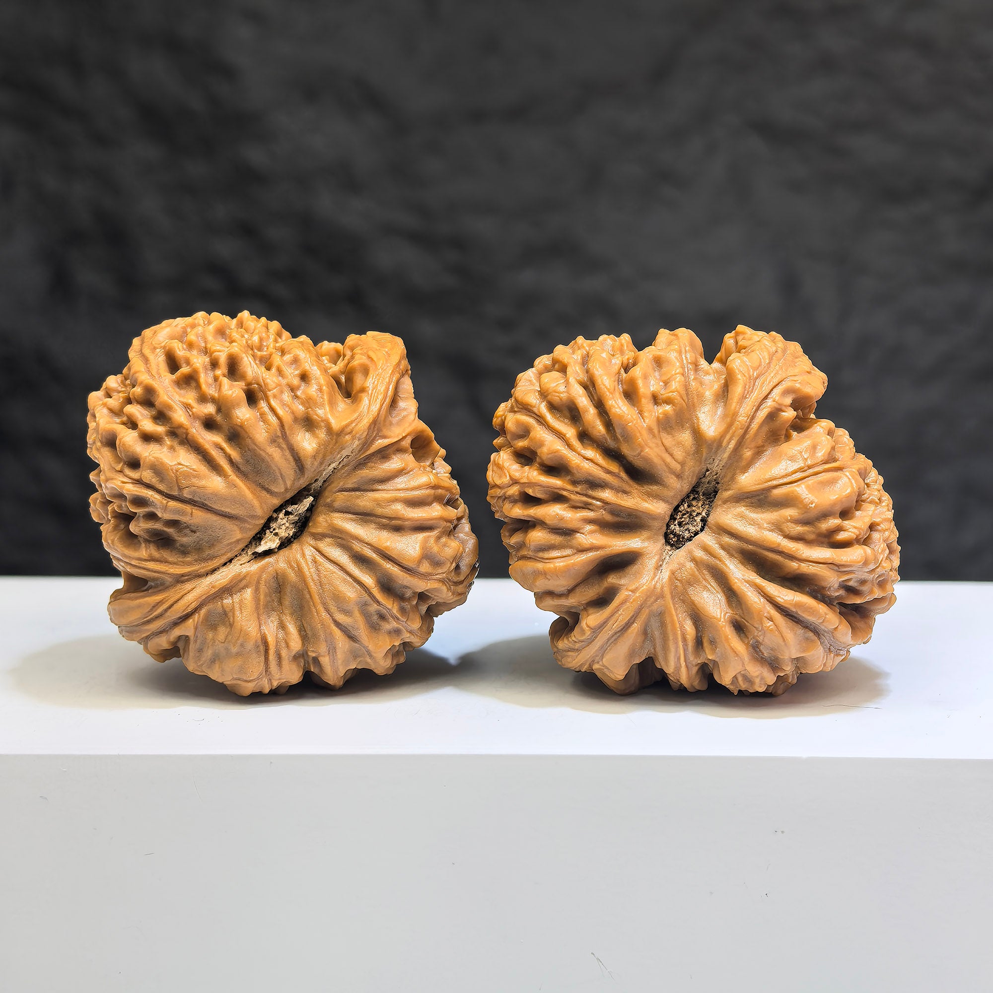 Pair of spherical Nanjiangstone Wenwan walnuts from Wenwan Art, round profile, 41mm x 43mm, showcasing smooth, polished stone surfaces.