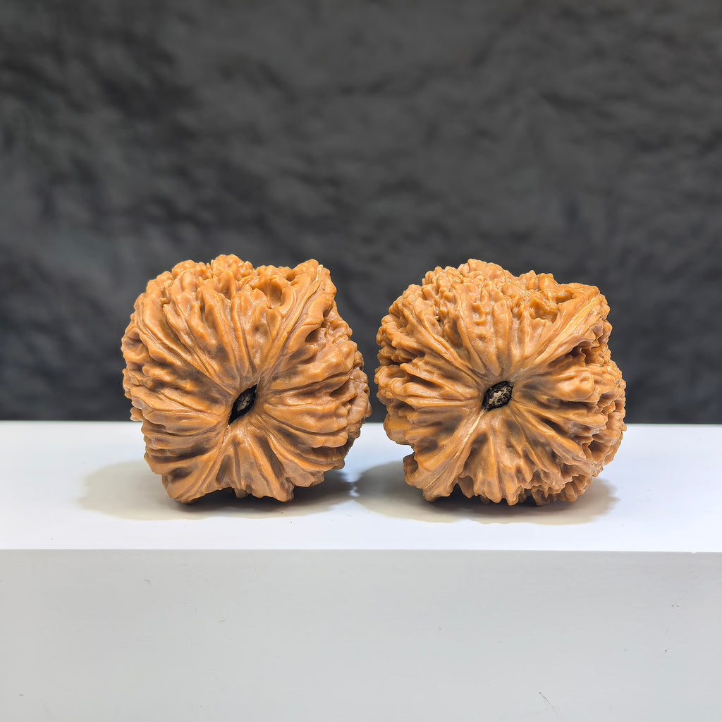 Pair of Nanjiangstone Wenwan walnuts from Wenwan Art, 38mm size, showcasing natural stone texture and craftsmanship.