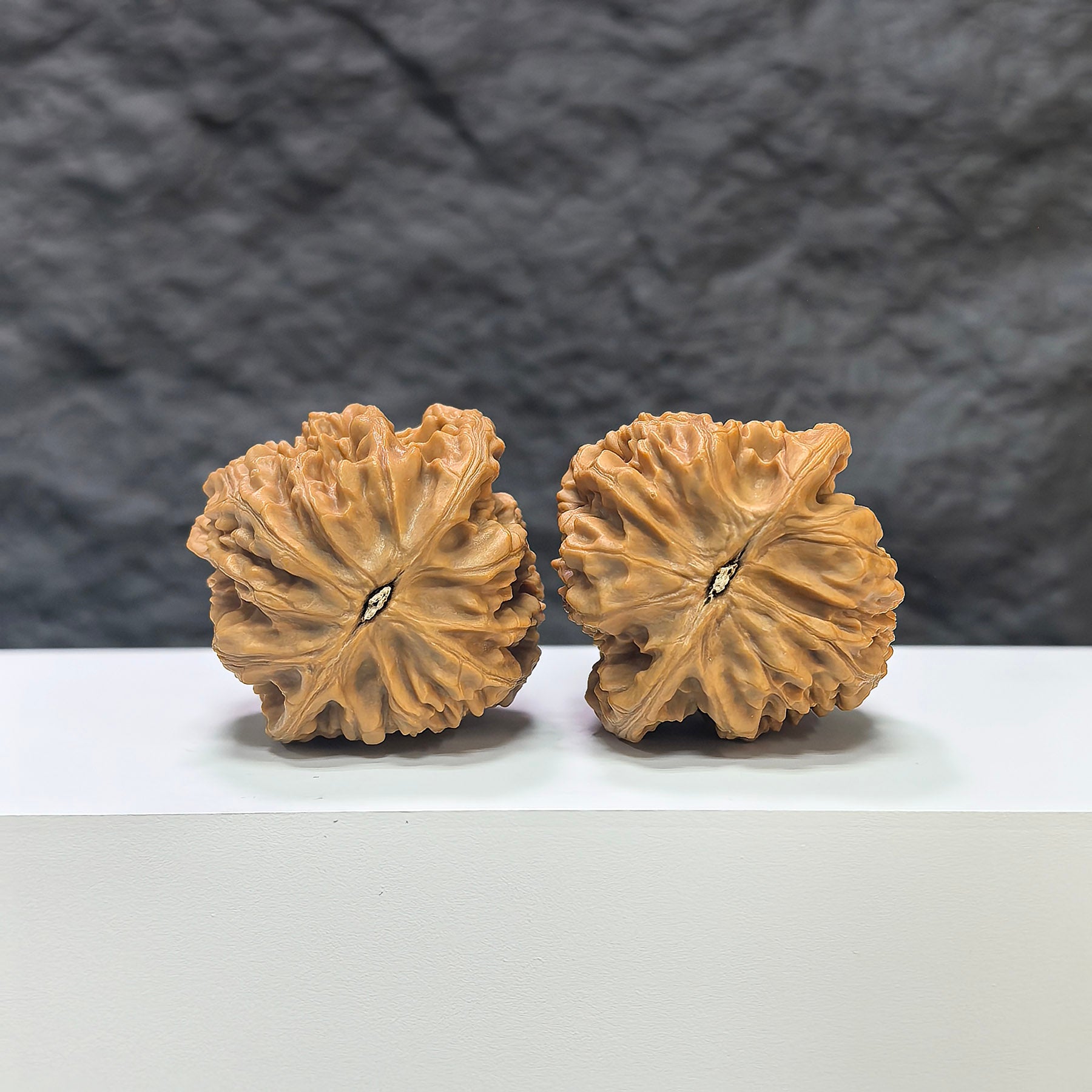 Pair of Beijing Chicken Heart Wenwan walnuts by Wenwan Art, featuring 41mm size with smooth, polished walnut shells.