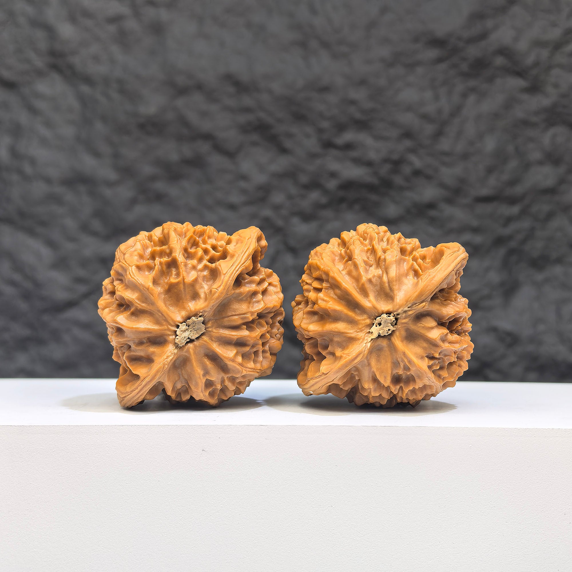 Pair of Peach Heart Palace Lantern Wenwan walnuts by Wenwan Art, 42mm x 38mm, featuring intricate carvings and peach heart shapes.