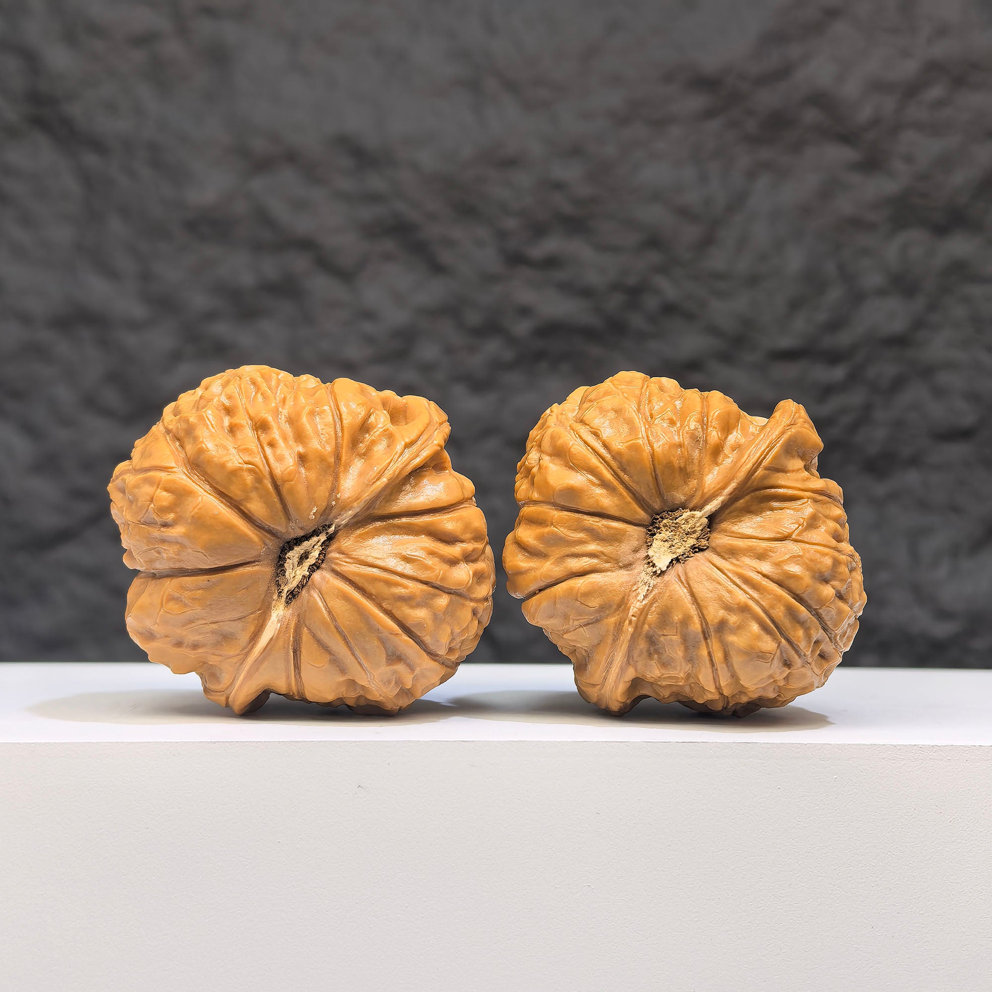Pair of Pumpkin Pier Wenwan Walnuts by Wenwan Art, featuring 40mm x 42mm classic walnut carvings with detailed pumpkin design.