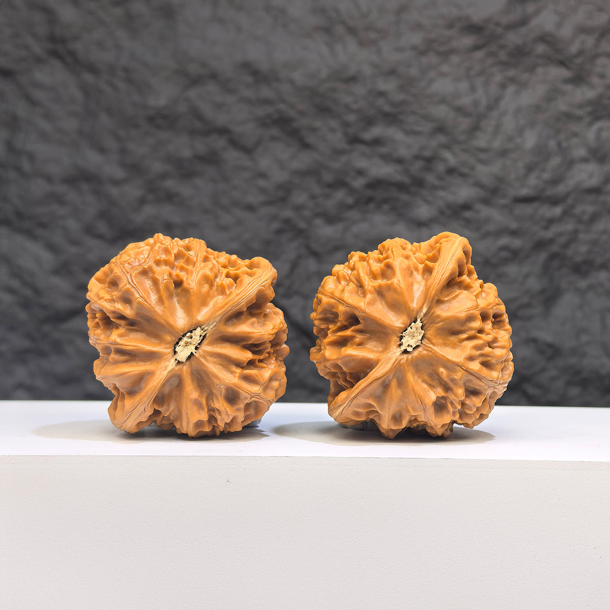 Pair of Palace Lantern Wenwan Walnuts by Wenwan Art, 42mm x 41mm, featuring intricate carved designs on smooth walnut surfaces.